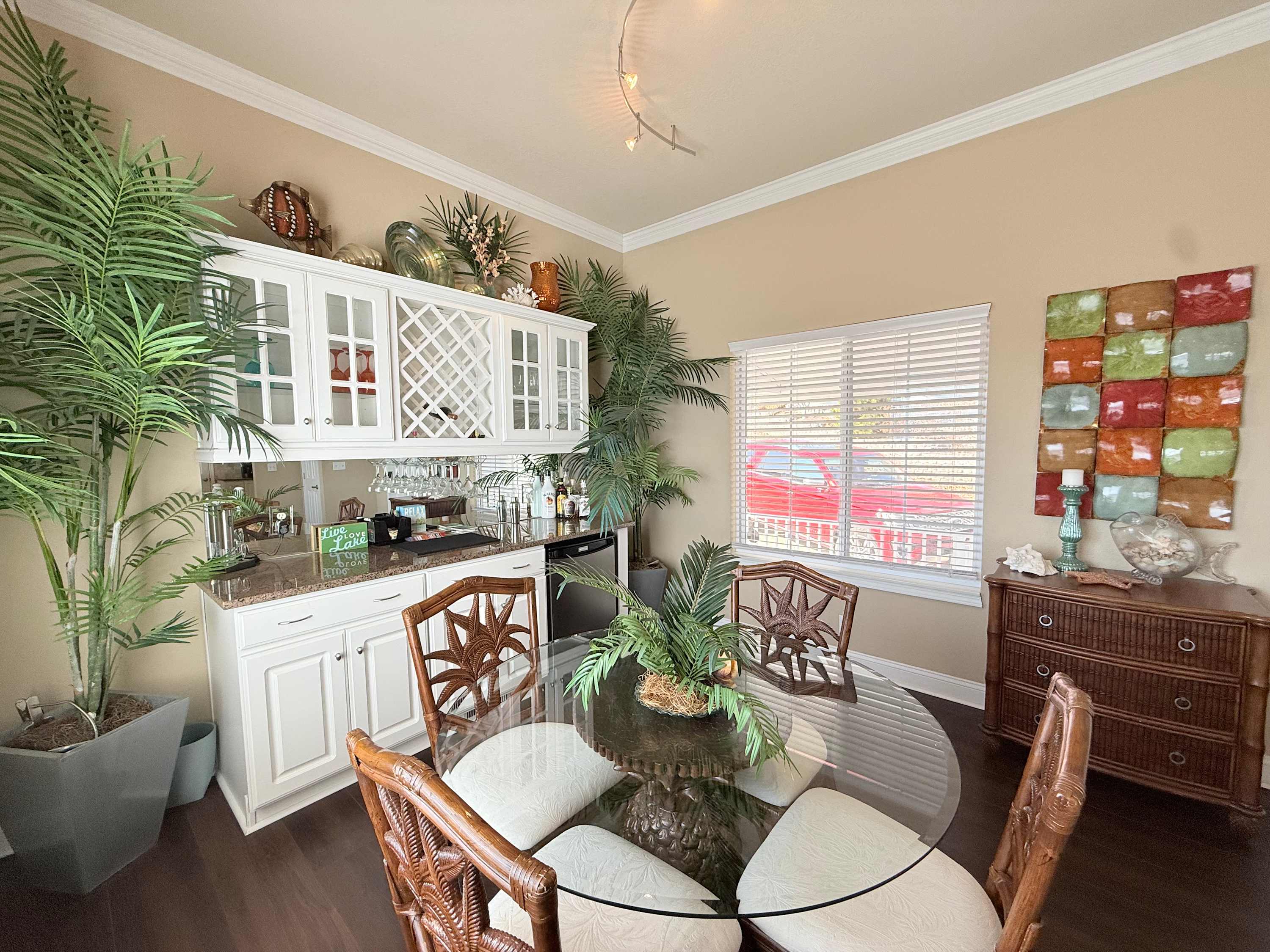 The dining area, seating 4, offers a dry bar with mini fridge – hello, cocktail hour!​