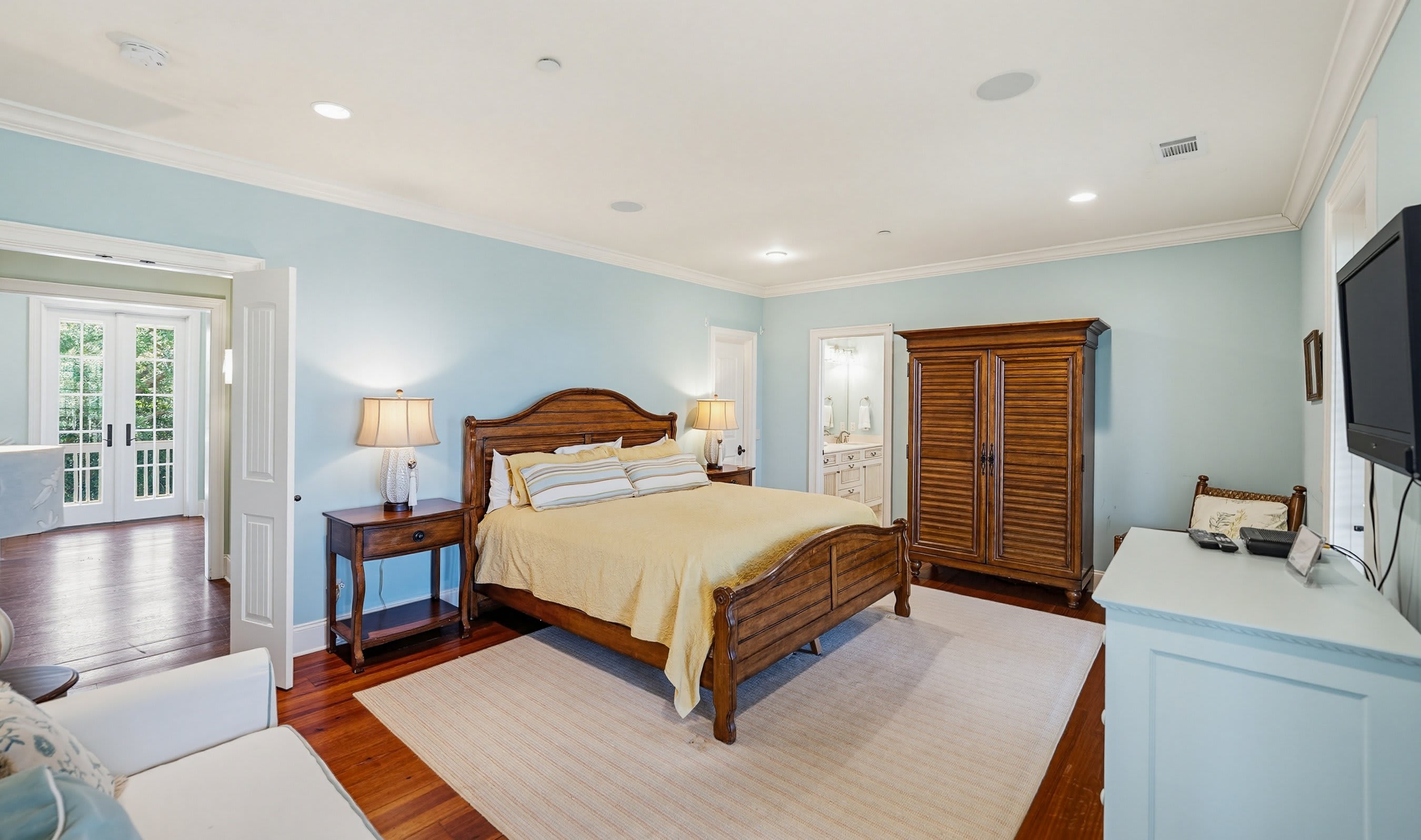 2nd Level Primary Bedroom with King Bed, Full En Suite Bathroom and Access to Back Porch