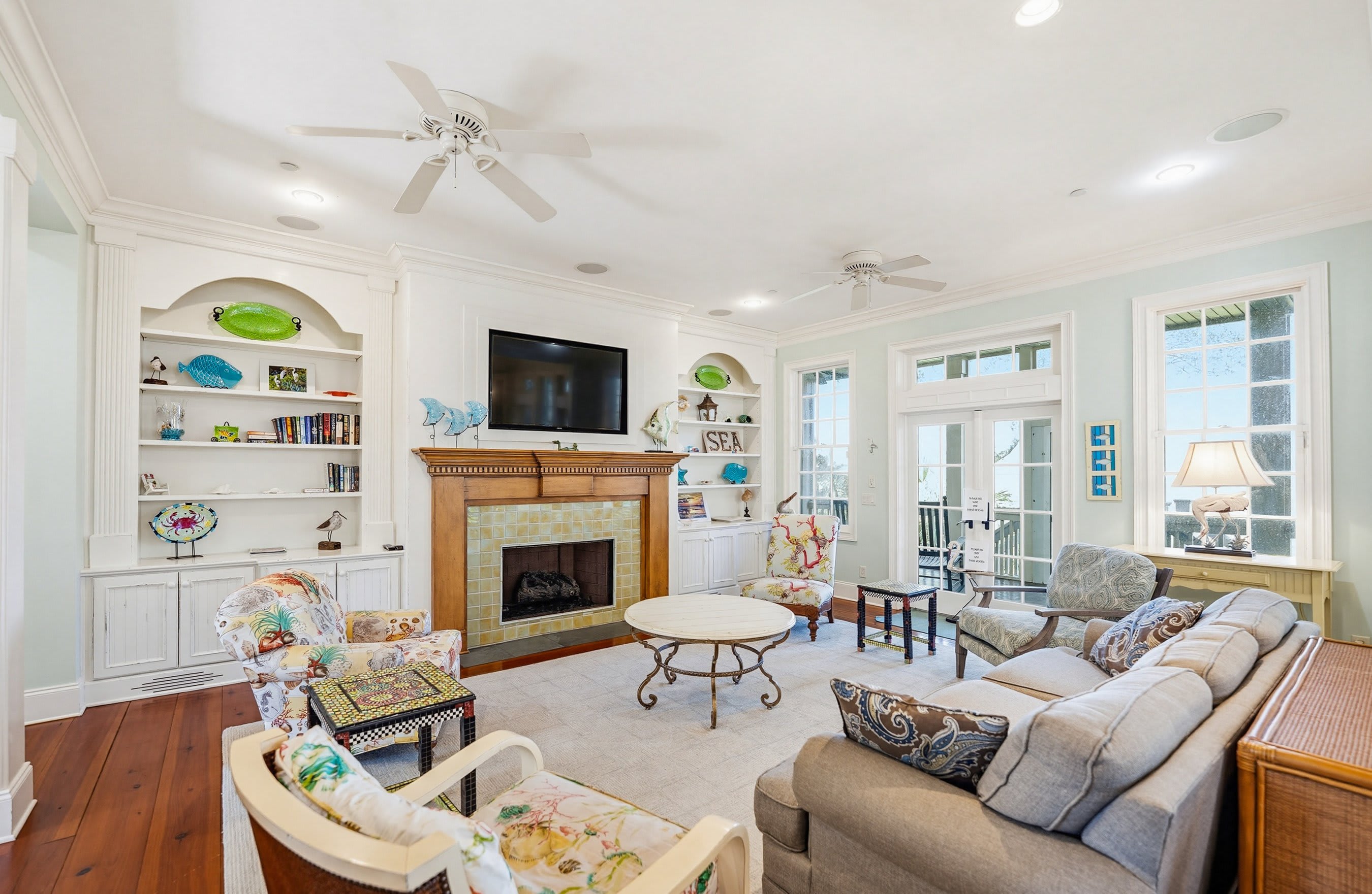 Open Concept Living Room with Dining Area and Kitchen Access to the Back Screened Porch