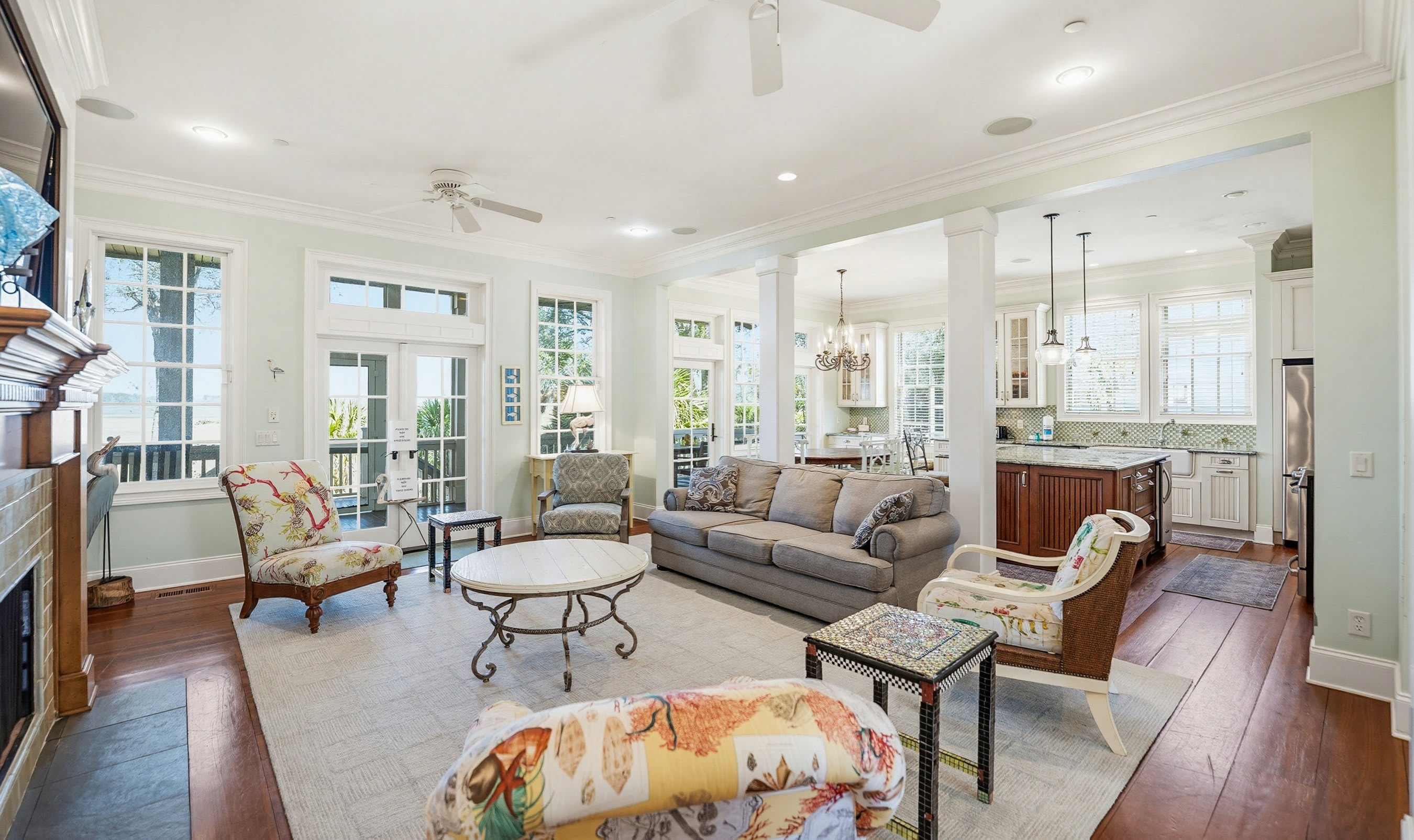 Open Concept Living Room with Dining Area and Kitchen Access to the Back Screened Porch