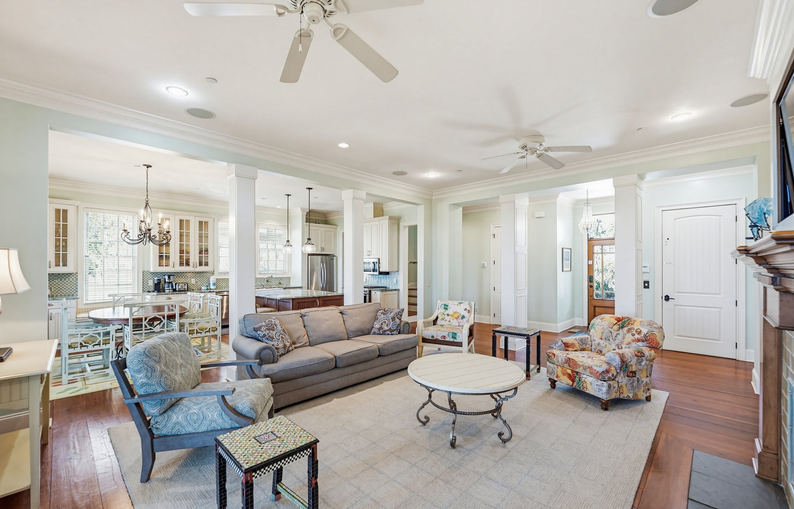 Open Concept Living Room with Dining Area and Kitchen Access to the Back Screened Porch
