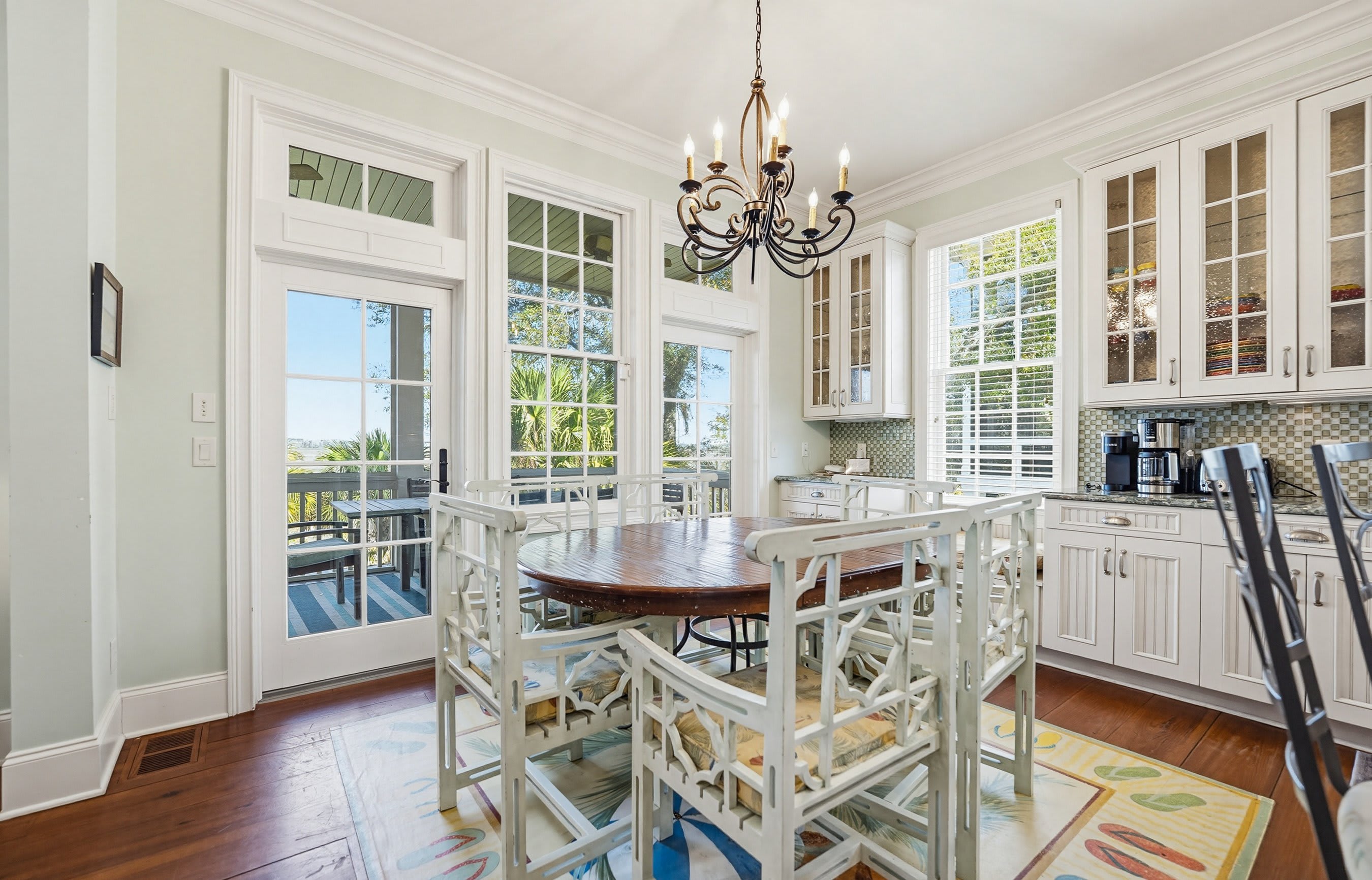Dining Area with Access to Screened Porch with Marsh Views