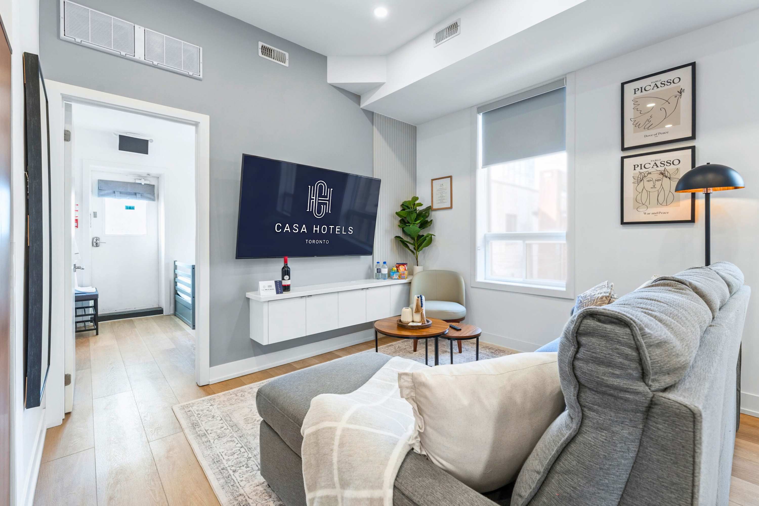 Living room featuring a large Smart TV and stylish decor.