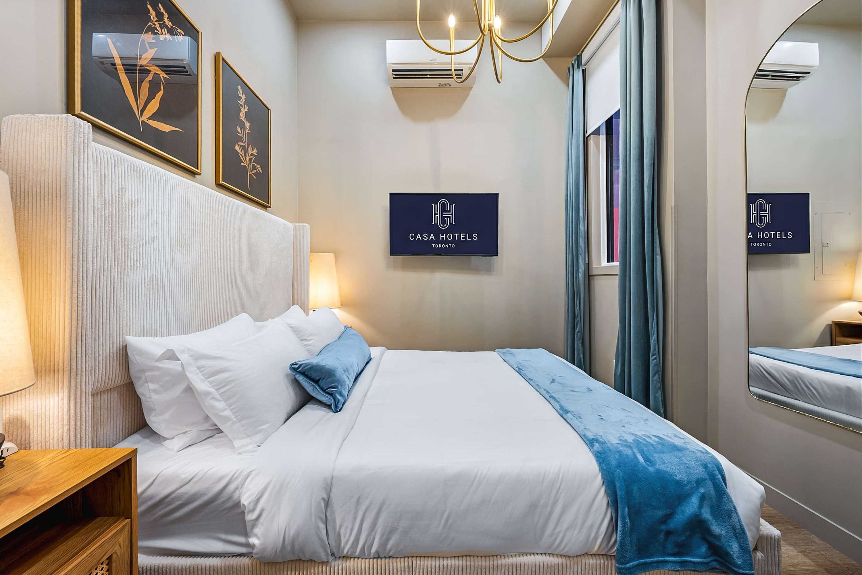 Serene bedroom with a plush queen bed and a smart TV.