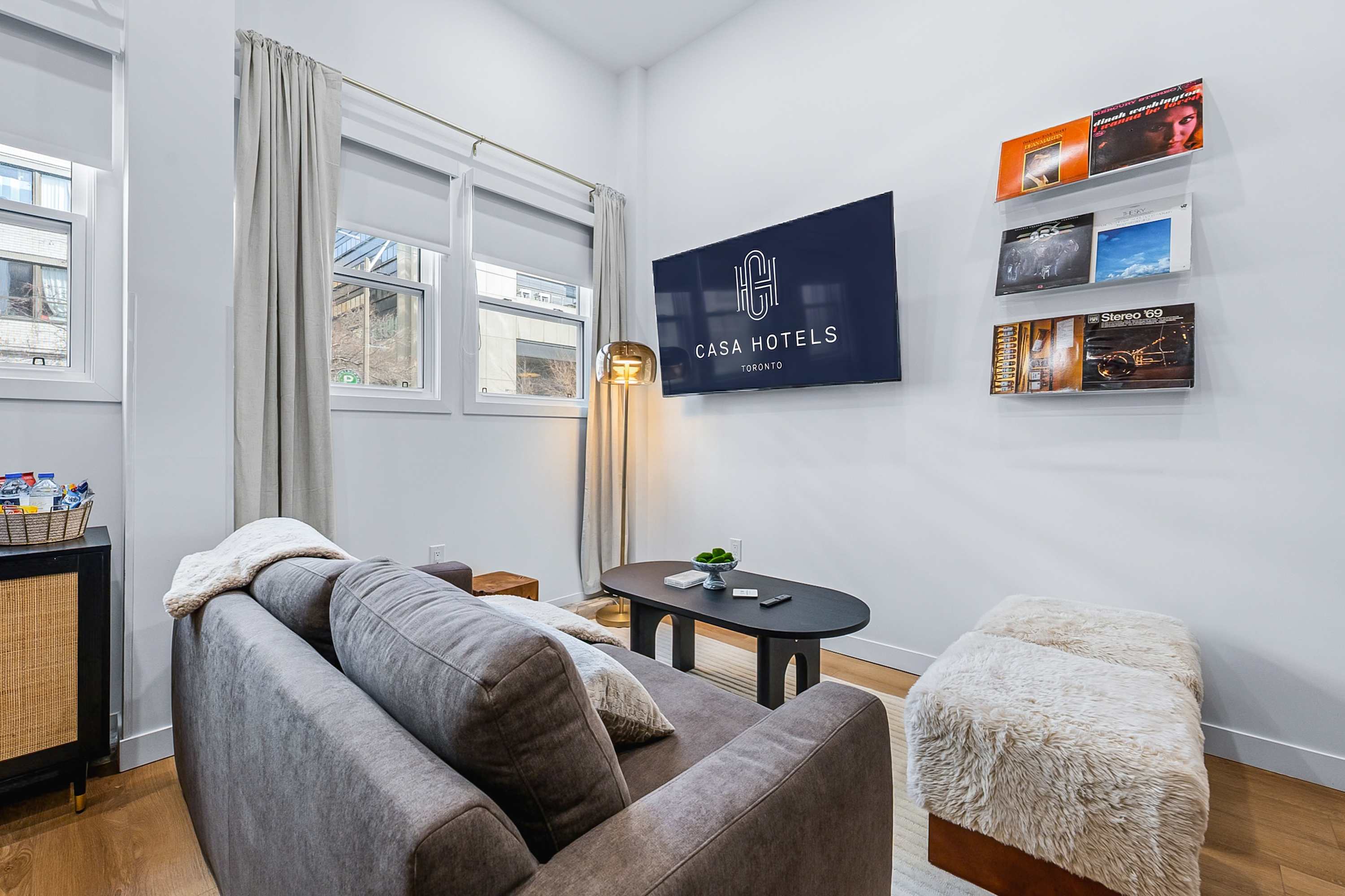 Cozy lounge with sofa, smart TV and modern décor.