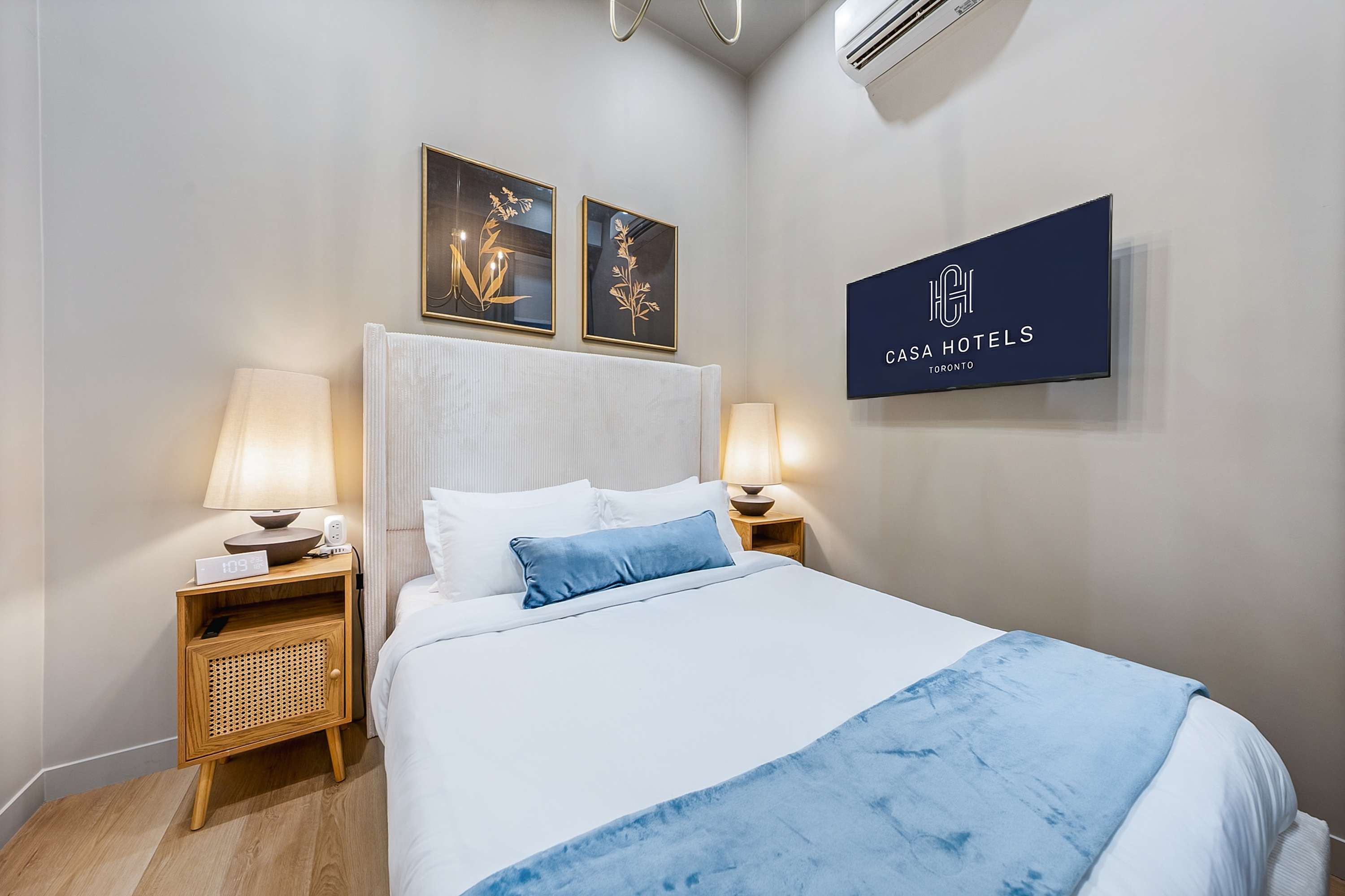 Serene bedroom with a plush queen bed and a smart TV.
