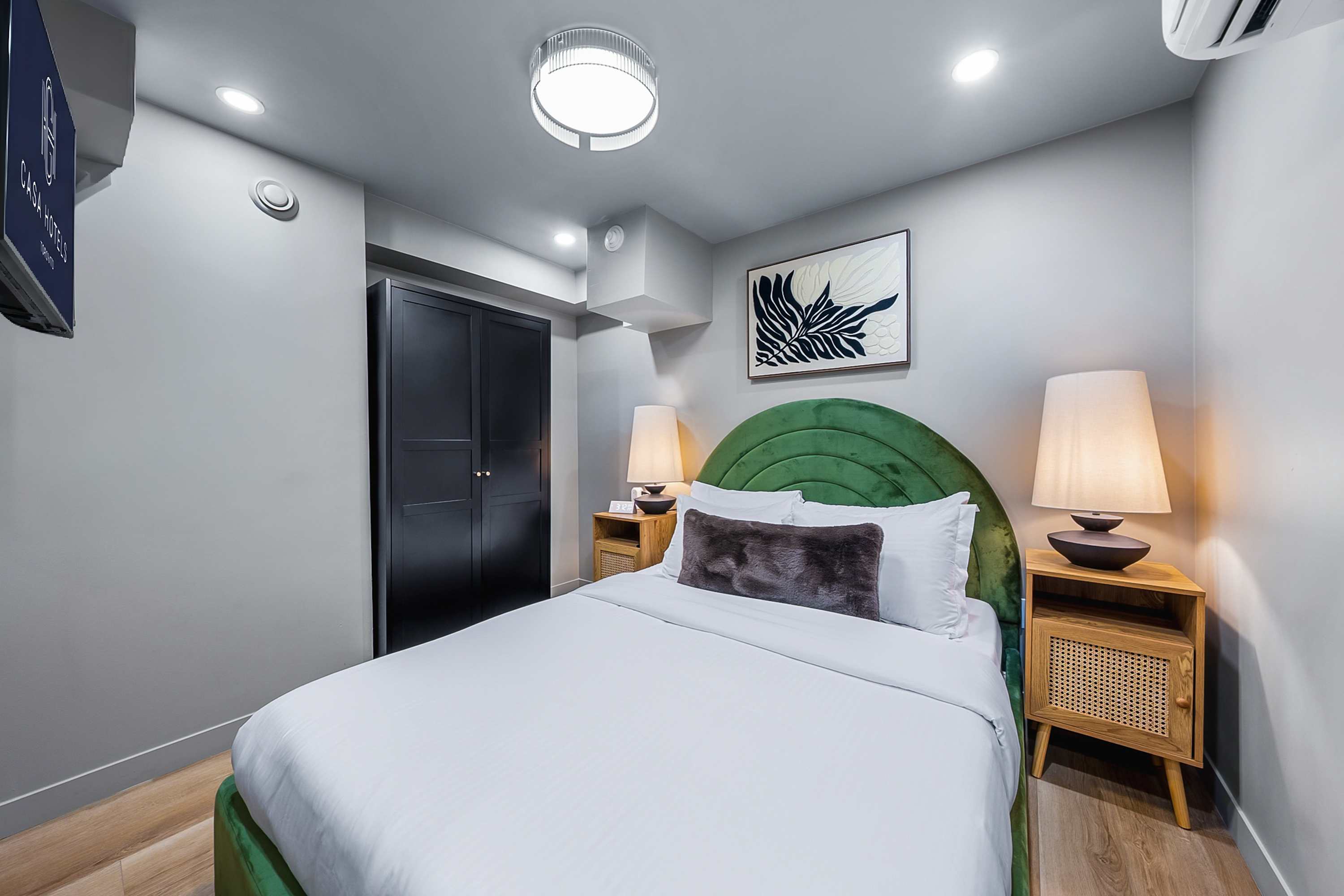 Unwind in a peaceful bedroom with warm textures and calming tones. 