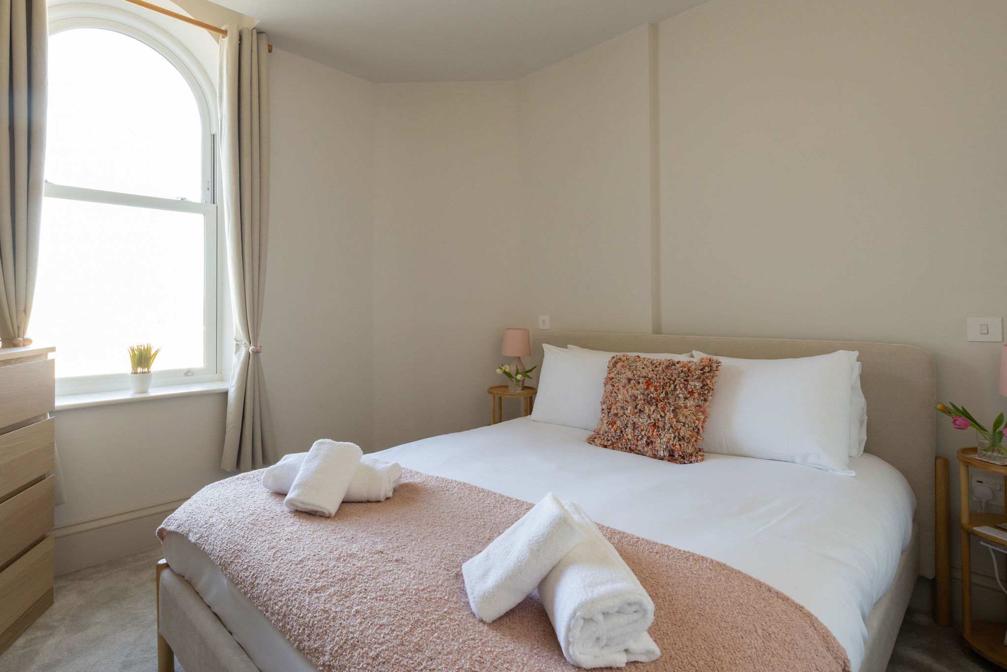 Soft, restful bedrooms offer a welcoming retreat after time spent by the sea.