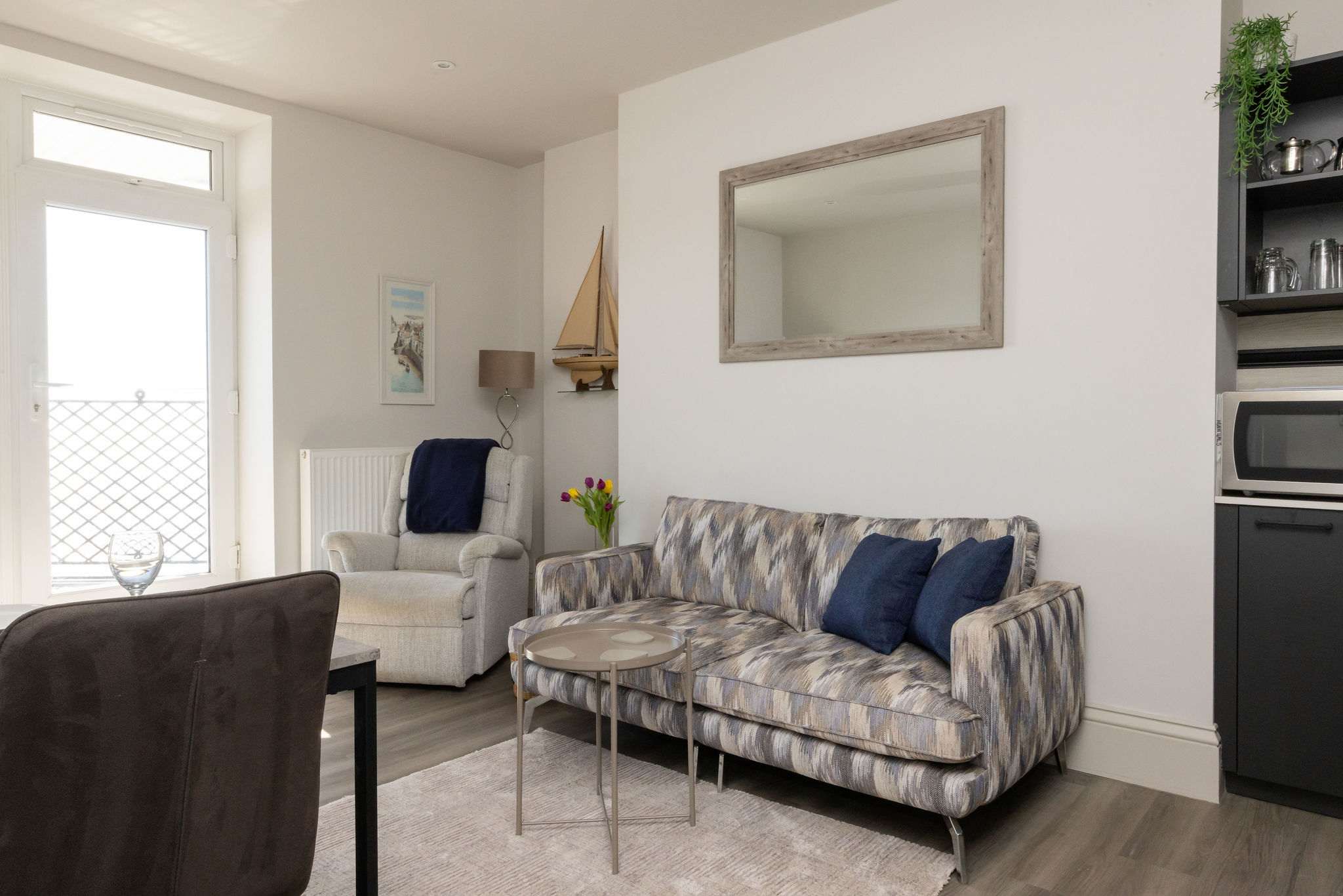 Comfortable interiors bring a calm coastal feel to this well-located apartment.
