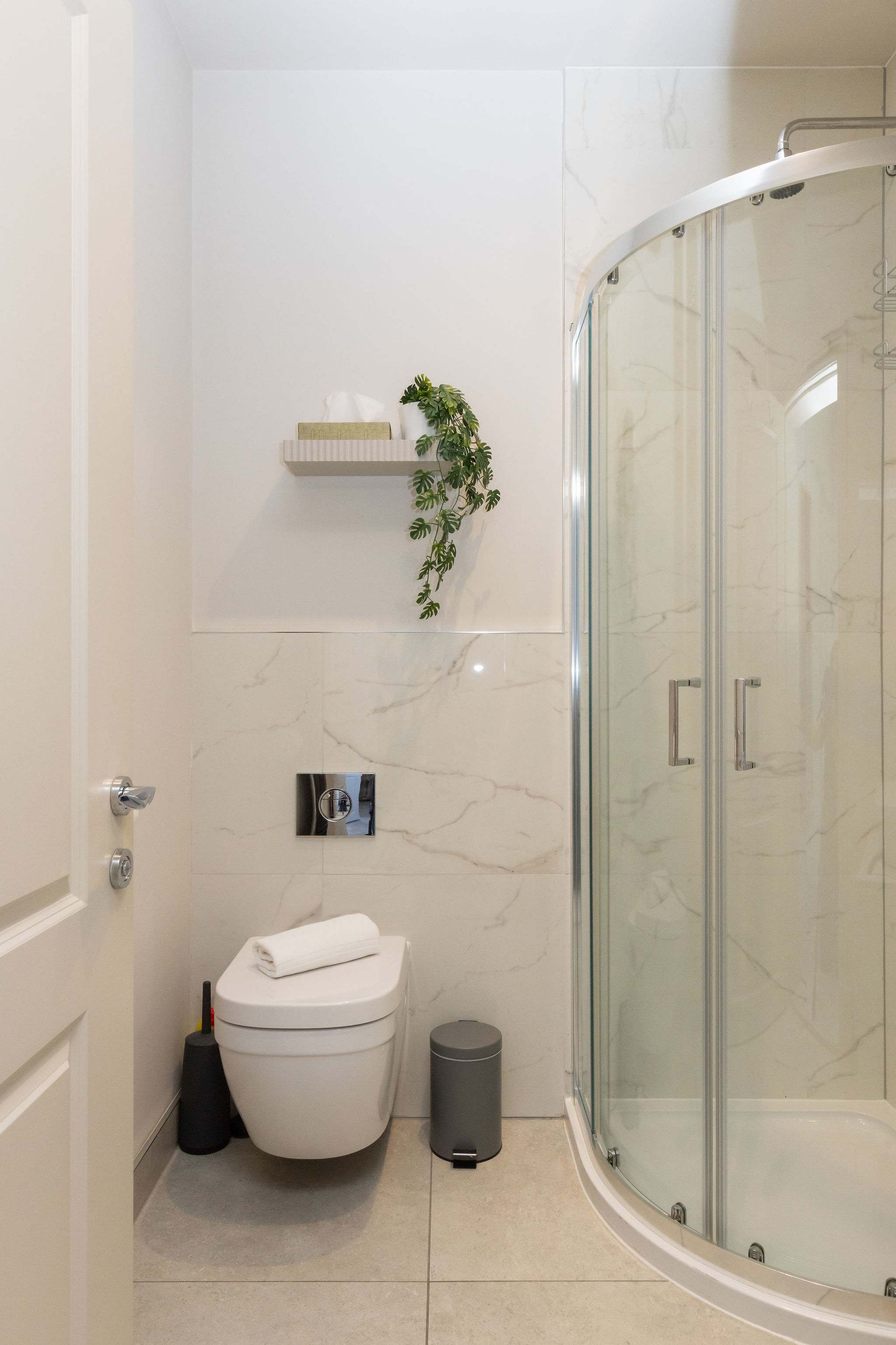 Clean, modern bathrooms complete this stylish and well-presented seafront apartment.