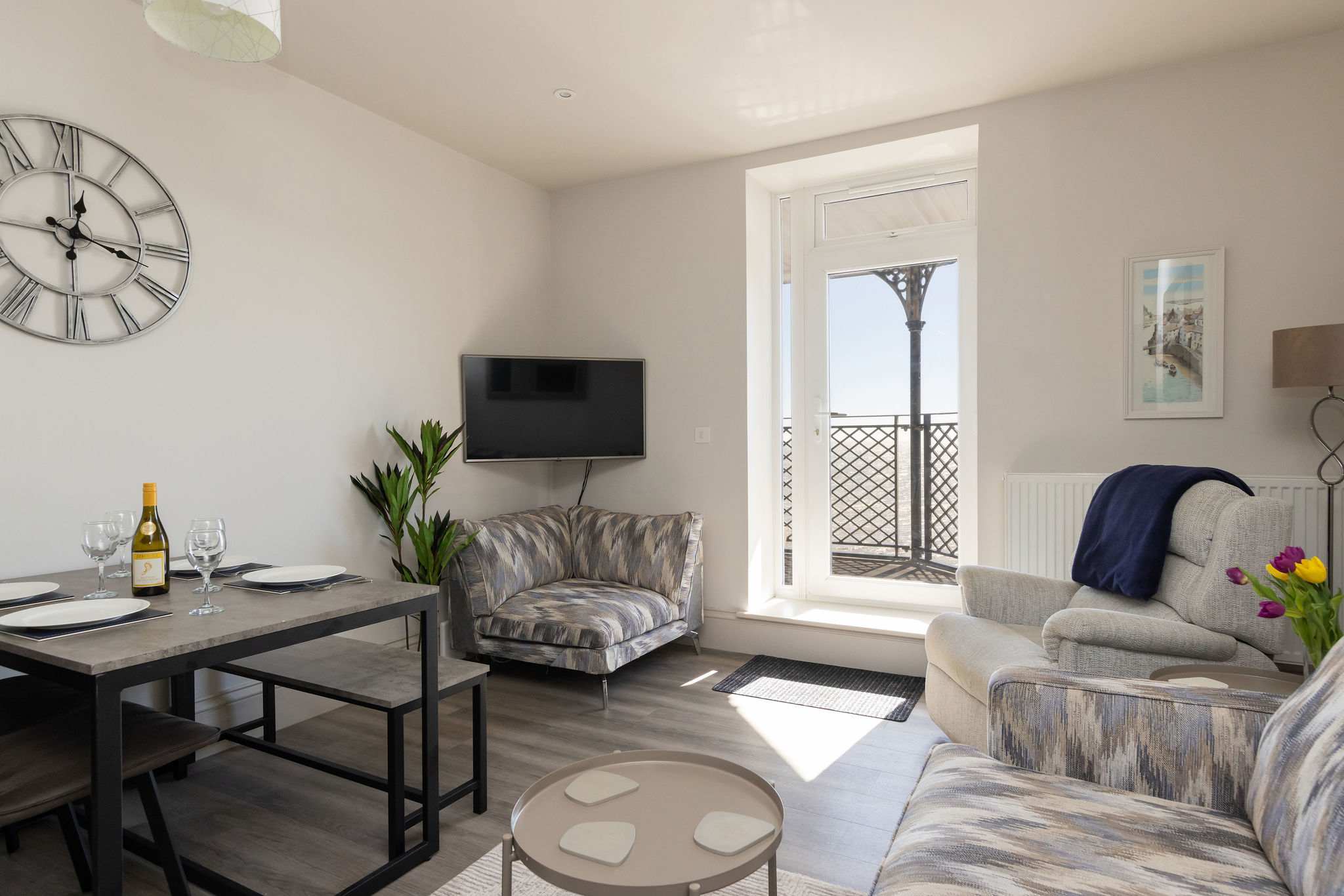 Light-filled living spaces and balcony access make this a relaxed and scenic seafront stay.