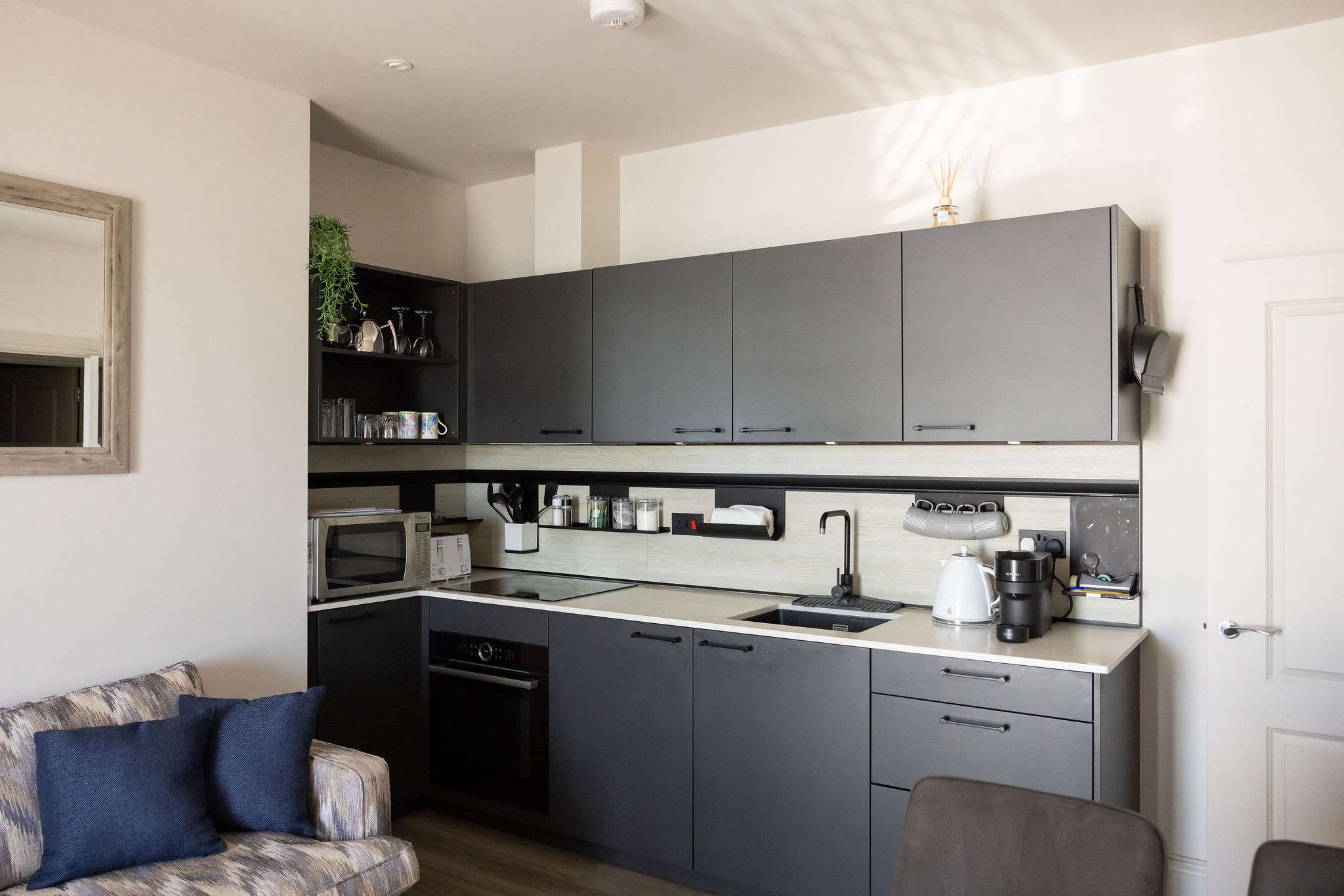 A modern, well-equipped kitchen makes relaxed coastal stays easy and enjoyable.