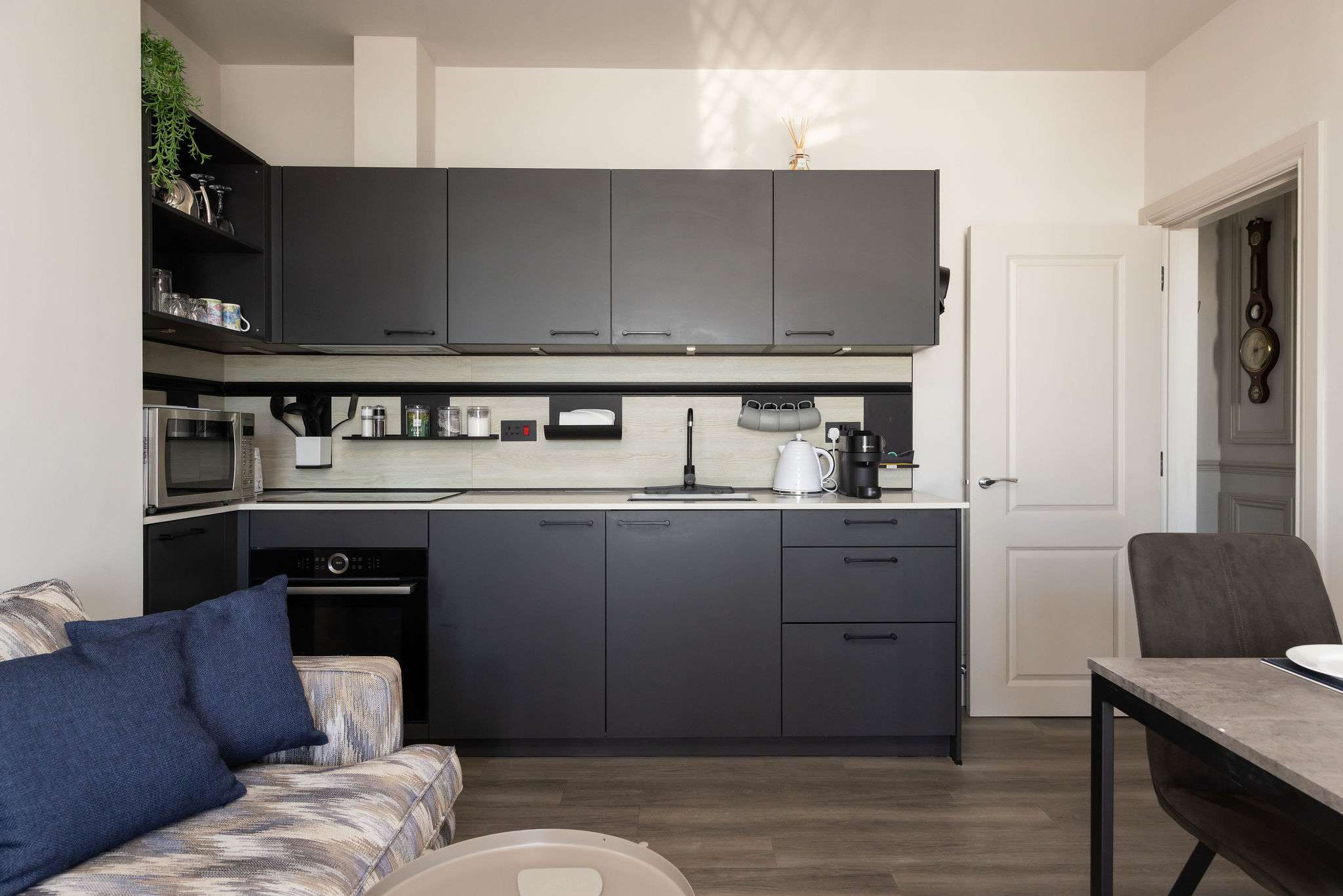 Modern interiors and a well-equipped kitchen make this seafront apartment ideal for an easy coastal stay.