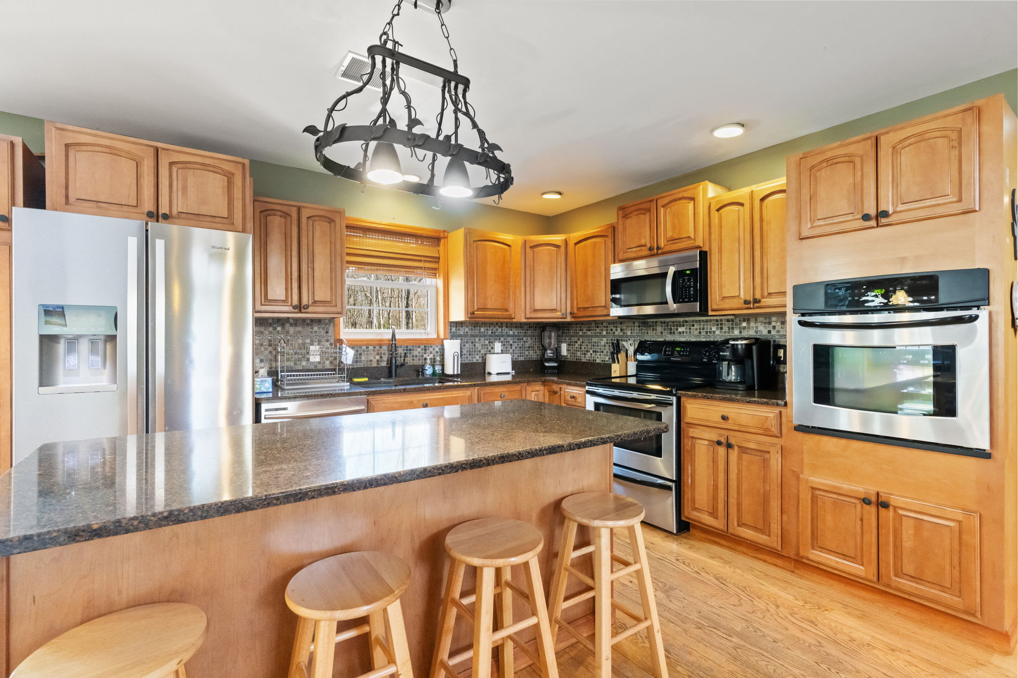 Open kitchen flows into the dining area with deck access for indoor-outdoor living