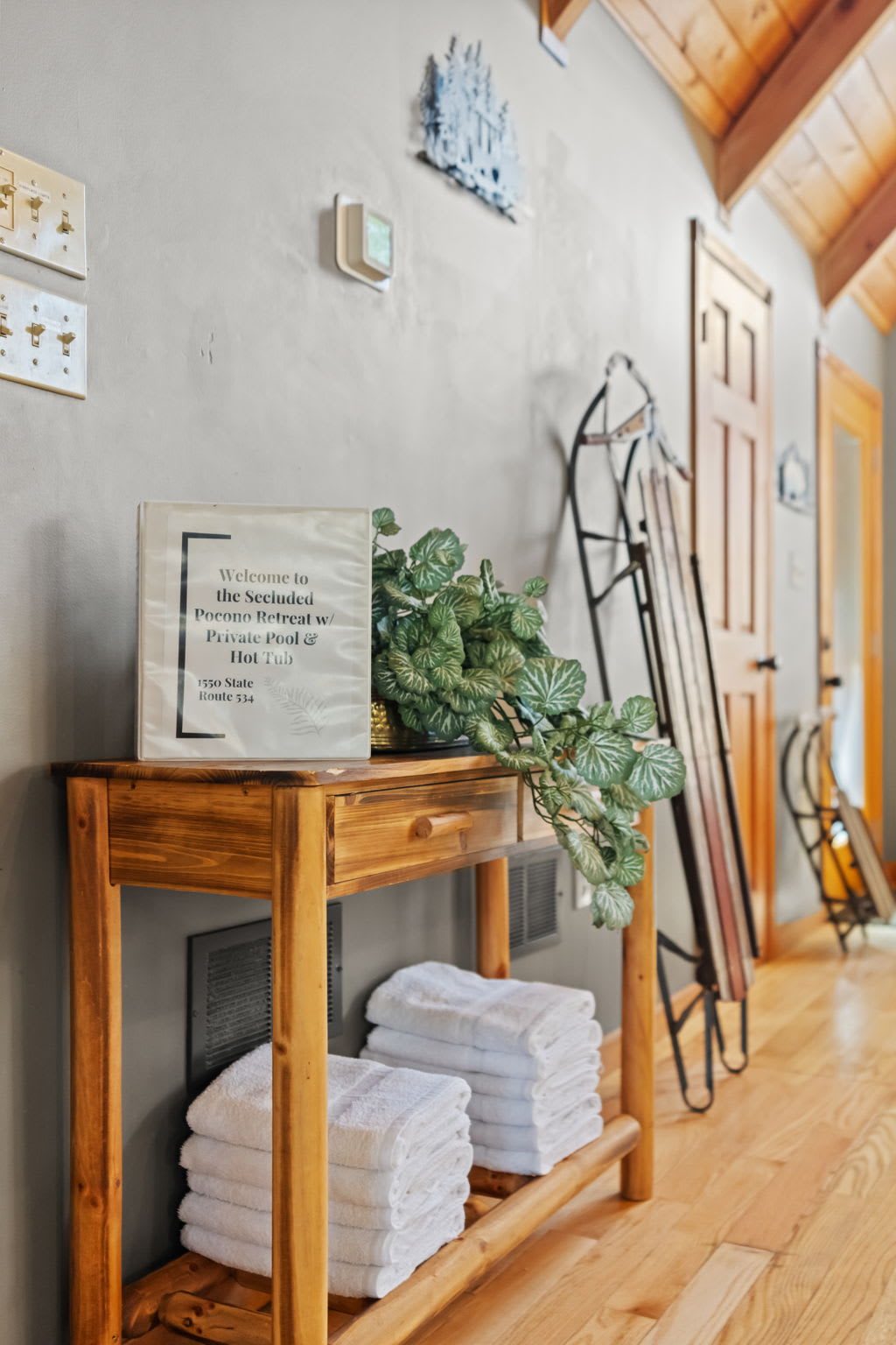 A welcoming entryway with fresh towels and a touch of greenery