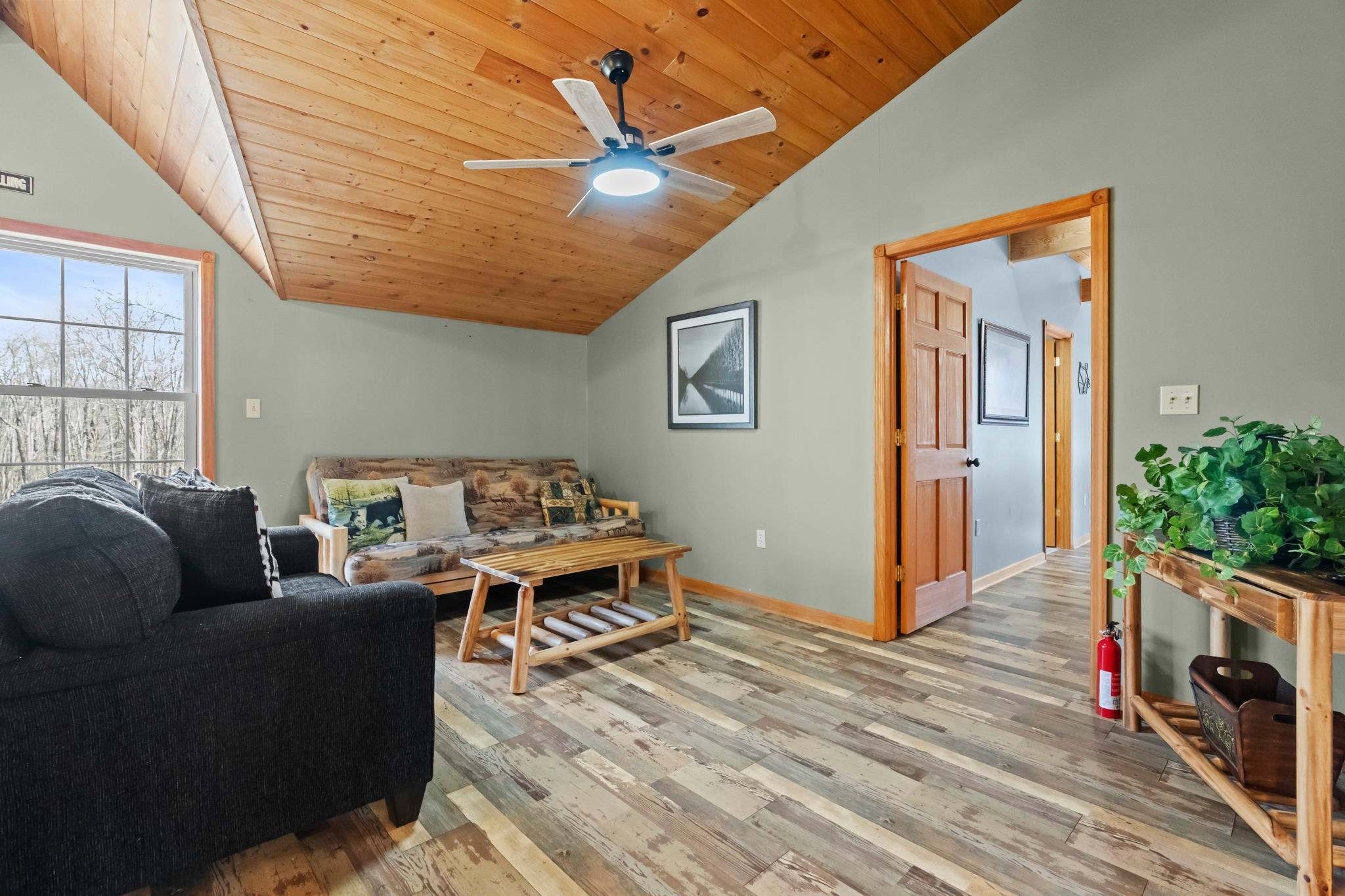 Settle into the loft den with comfy seating and cabin-inspired details