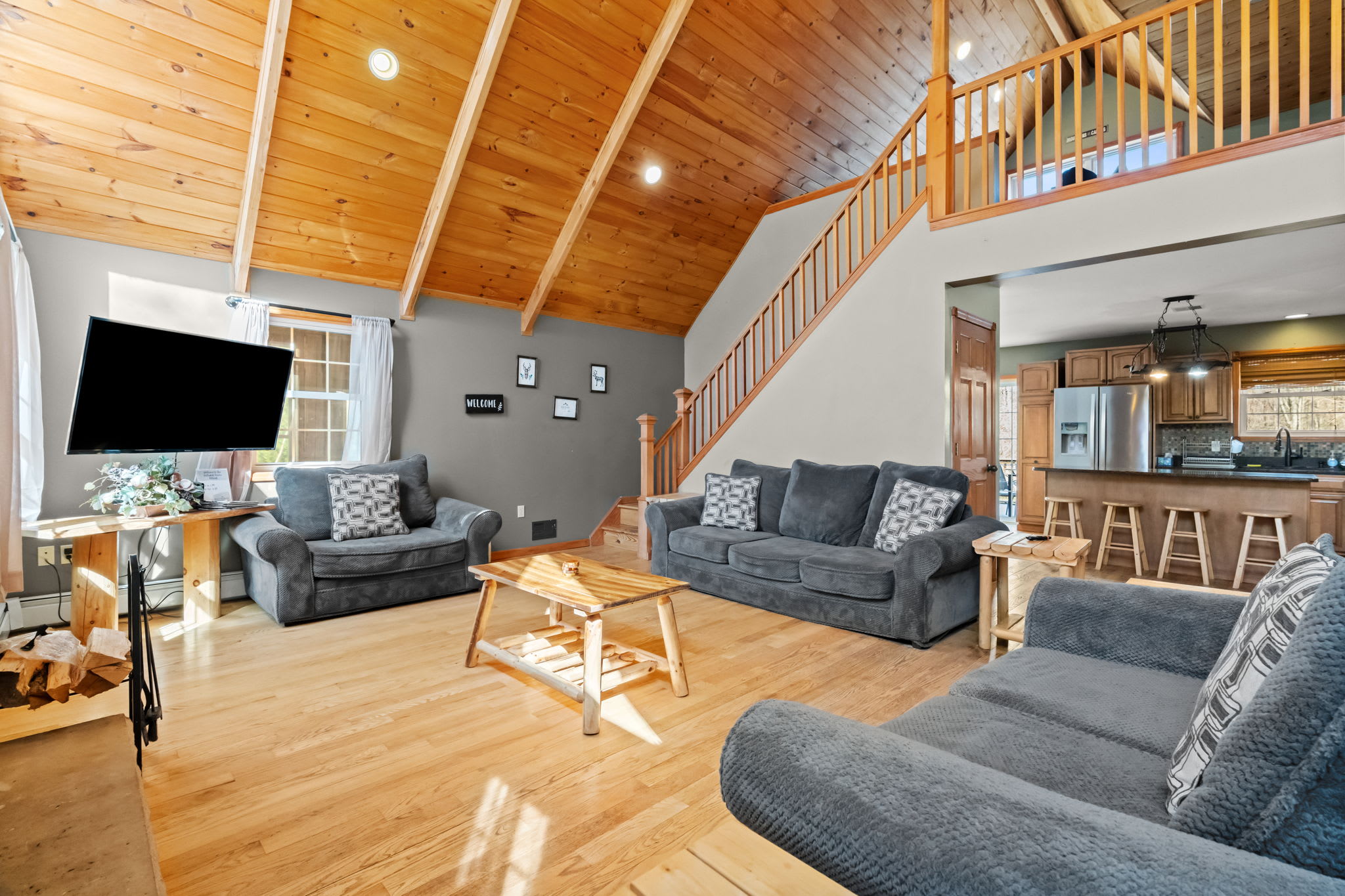 Warm glow from the stone fireplace fills the living room on chilly evenings