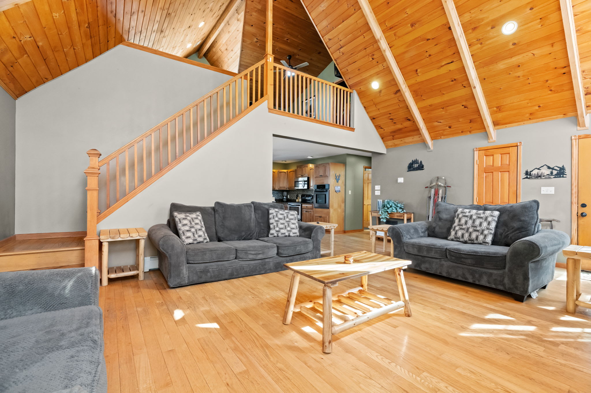 Sink into the sofa by the fire with soaring A-frame ceilings above