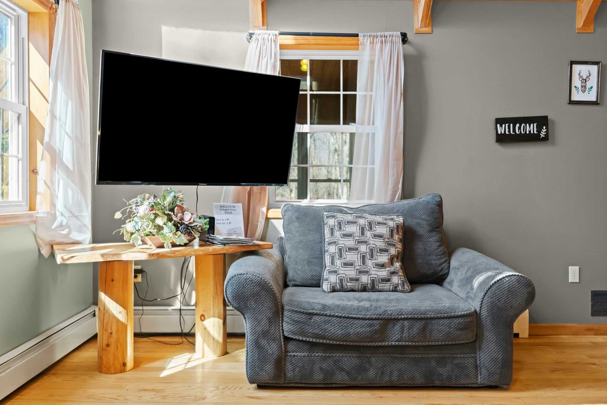 Kick back in the lower-level lounge with comfortable seating and hardwood floors