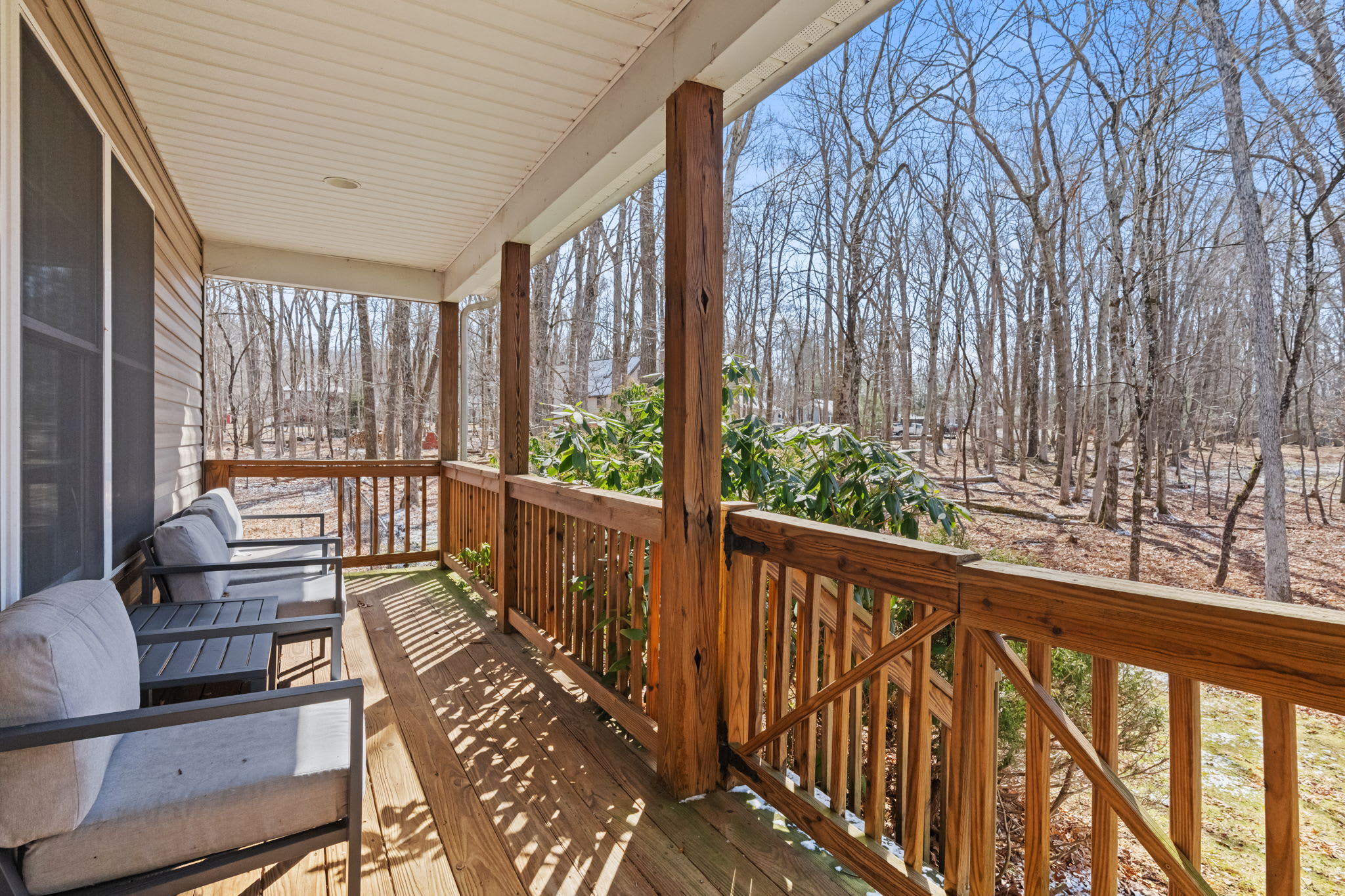 Step out onto the wraparound deck and take in the peaceful wooded surroundings