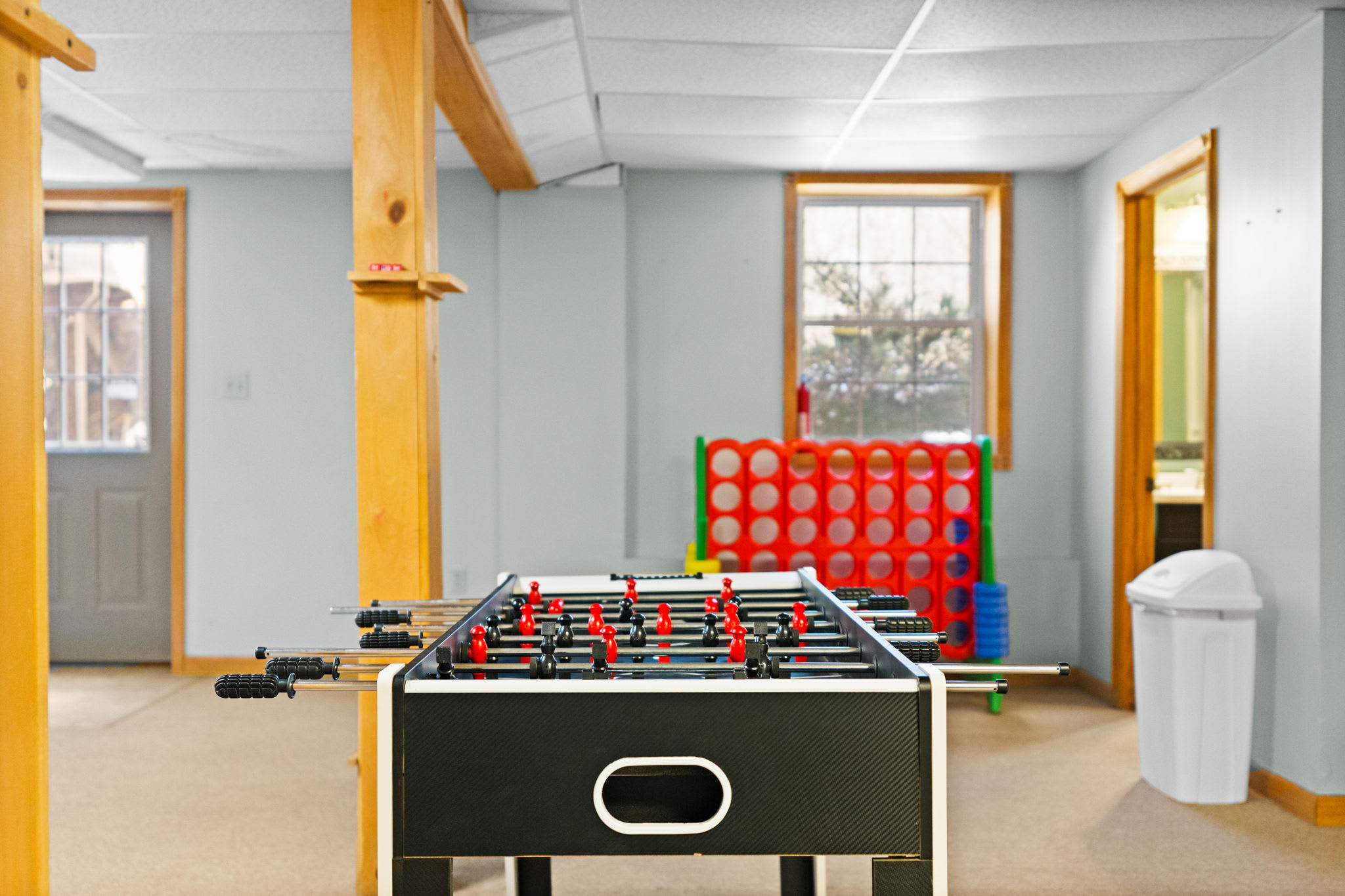 Beer pong and foosball await in this fun-filled game room with hardwood floors