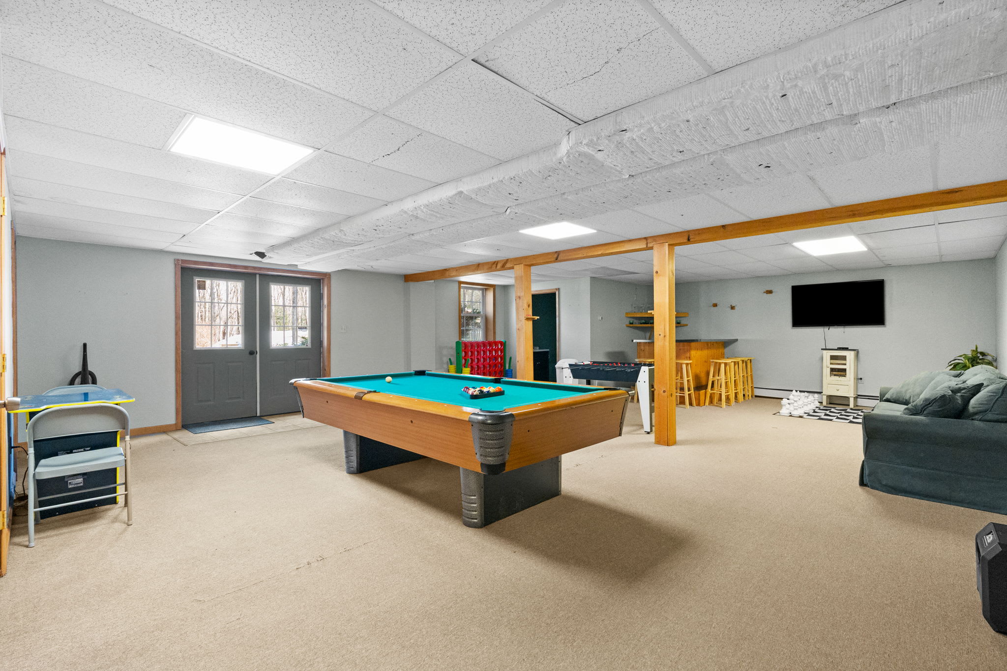 The game room offers a pool table and plenty of space for friendly competition