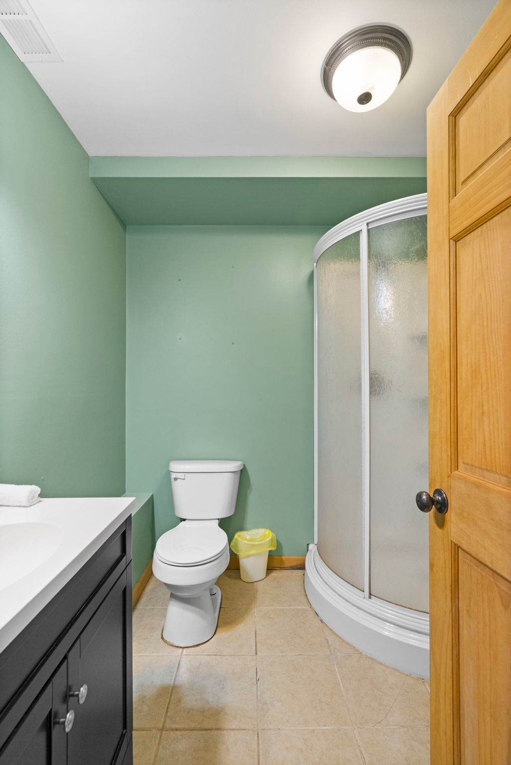 Step through the warm entryway with gleaming hardwood floors and natural light