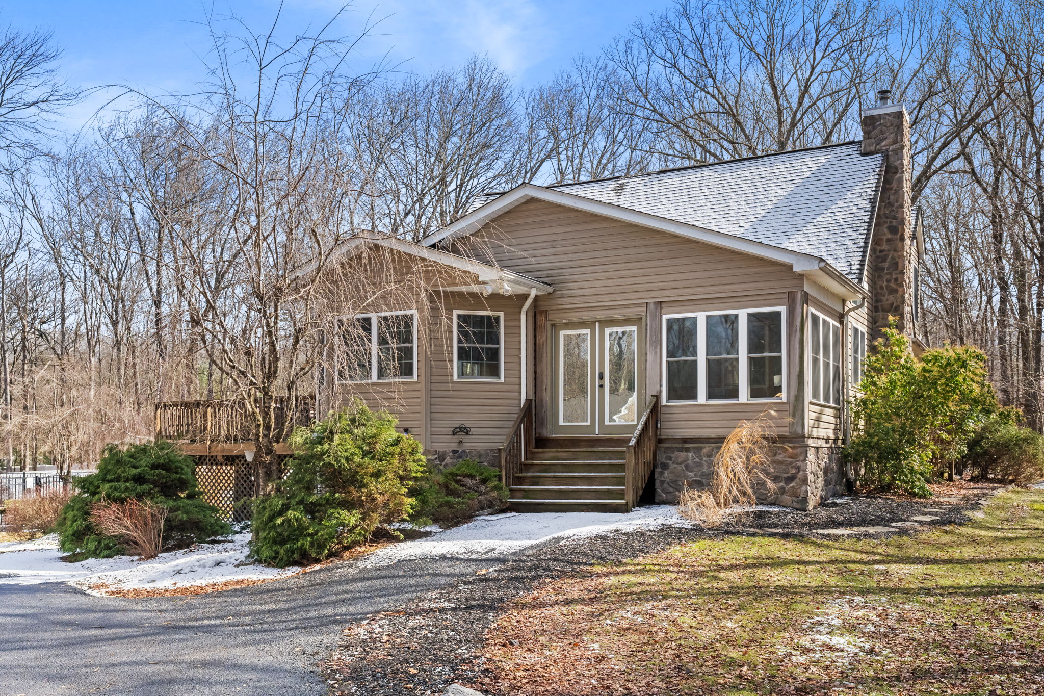 Welcoming front porch and entrance to the charming Pocono mountain cabin