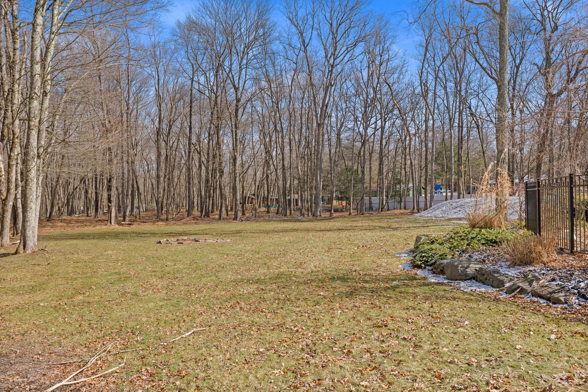 Tree-lined driveway welcomes you to this private Pocono mountain getaway