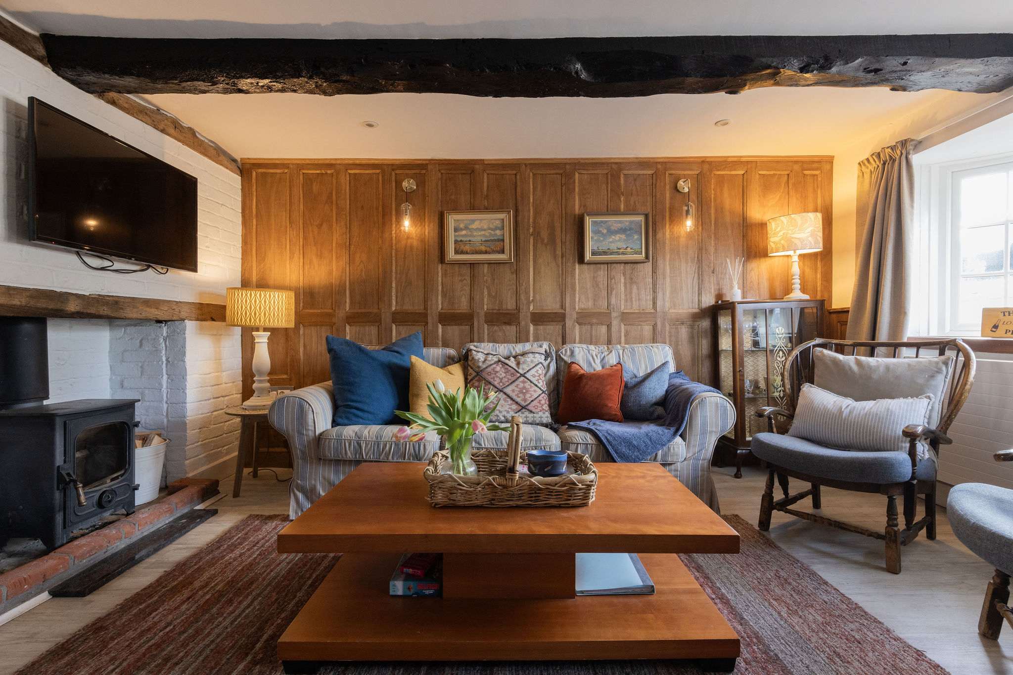 Cosy up by the log burner after a day by the sea