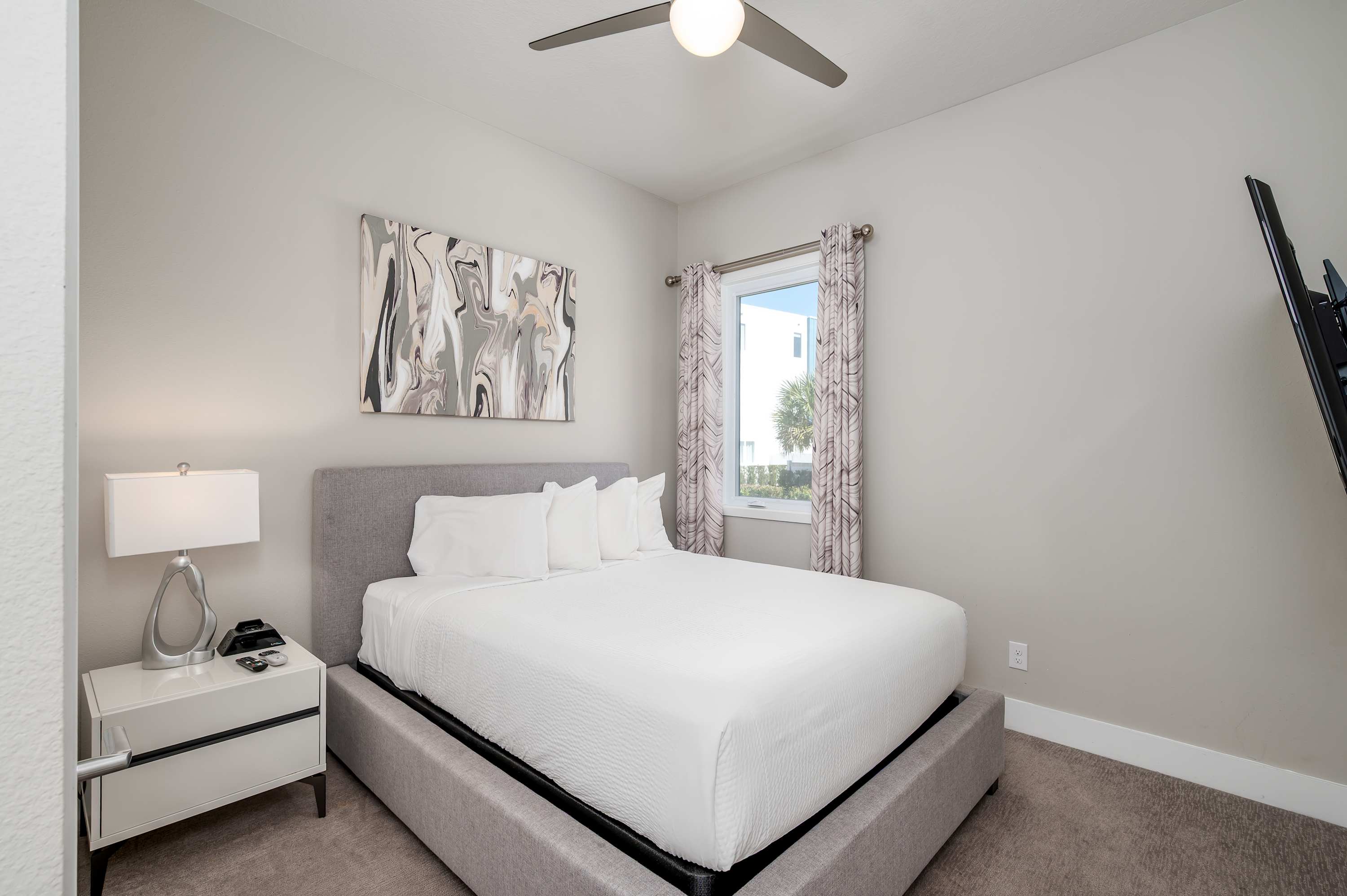 Modern bedroom with a comfortable bed and natural light from the window