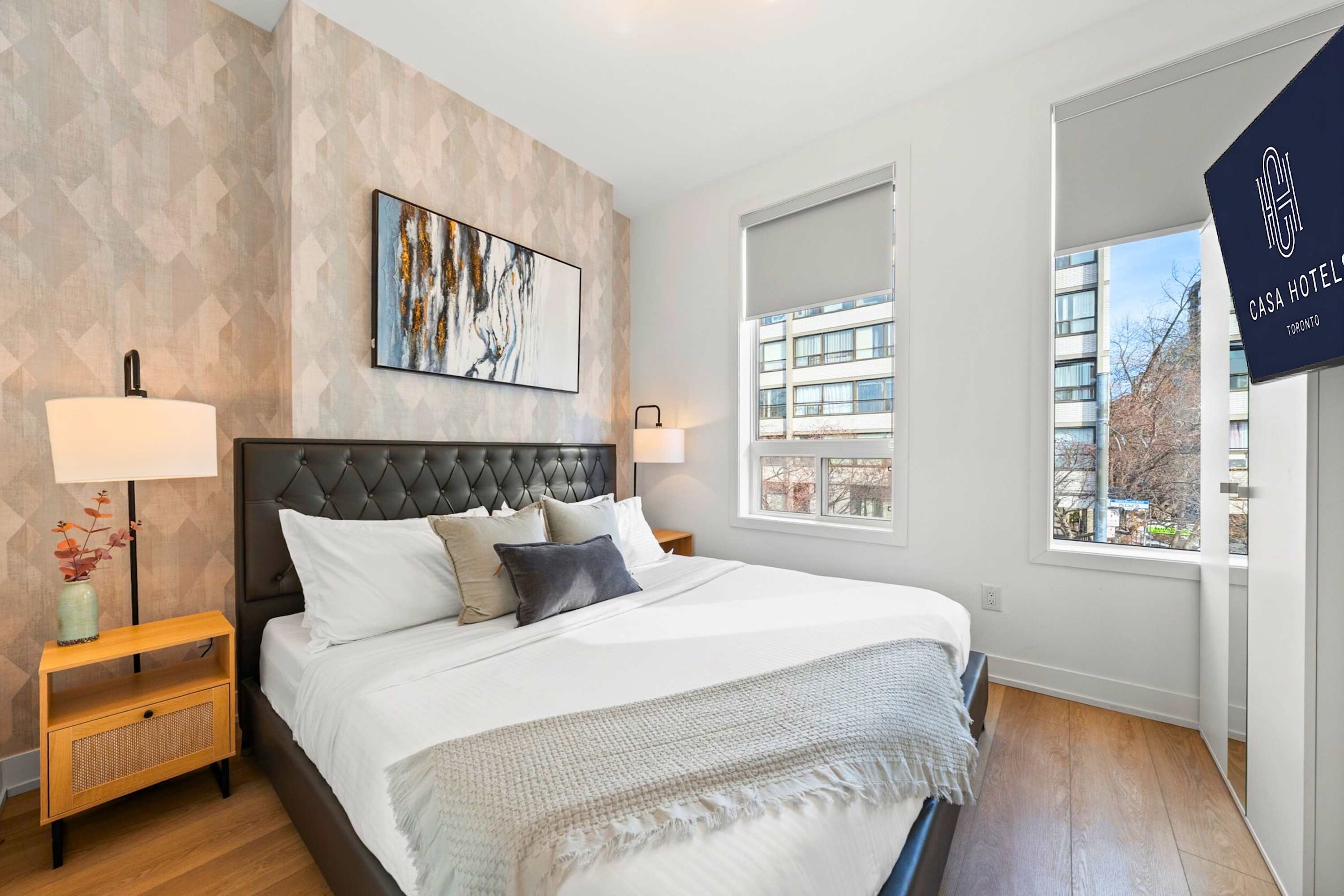 Elegant bedroom filled with abundant natural light.