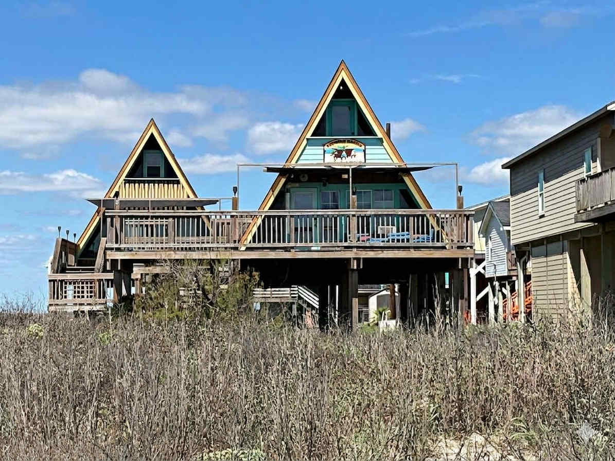 The Tiki Hut Polynesian A Frames at the Beach