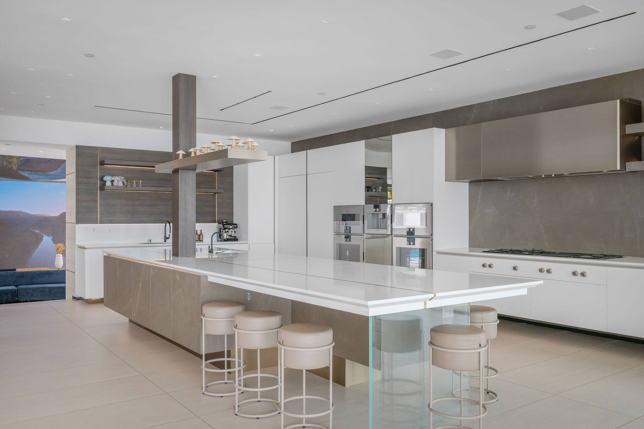 Designer kitchen island with integrated seating and premium appliance suite.