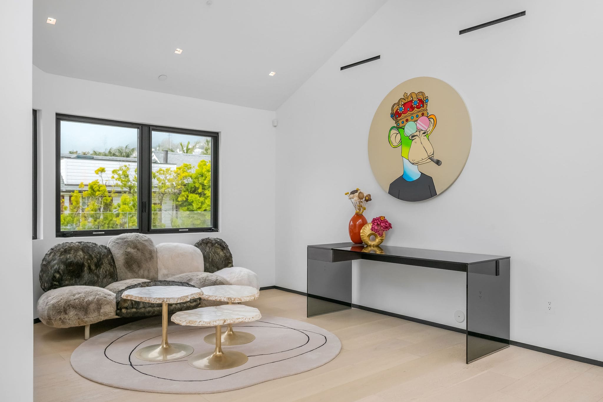 Private lounge with statement artwork and curated seating area.