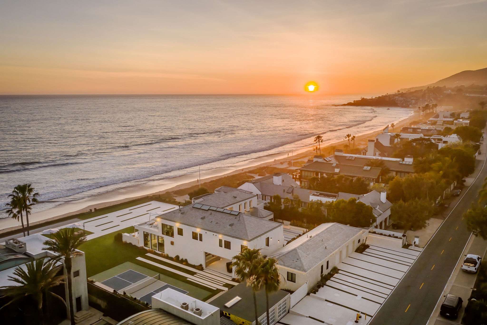 Private beachfront compound with two residences and panoramic Pacific views.