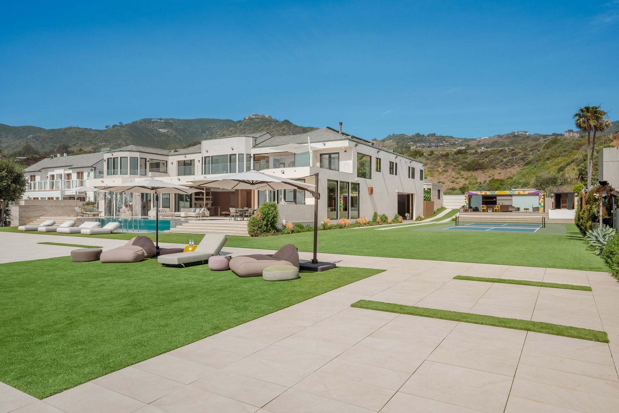 Malibu beachfront estate with expansive lawn and direct Broad Beach access.