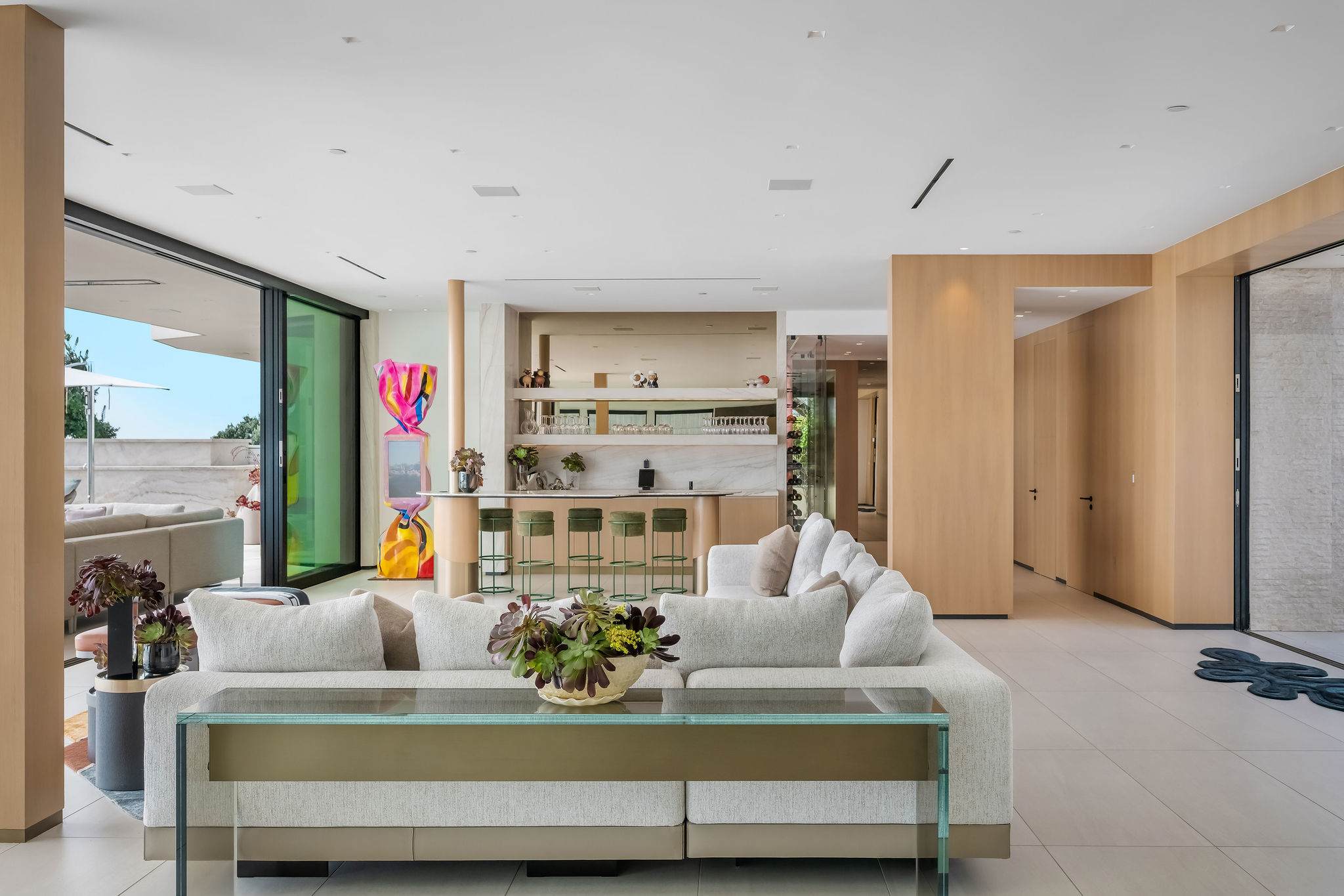 Move easily between lounge, bar, and kitchen in one continuous open-plan living space.