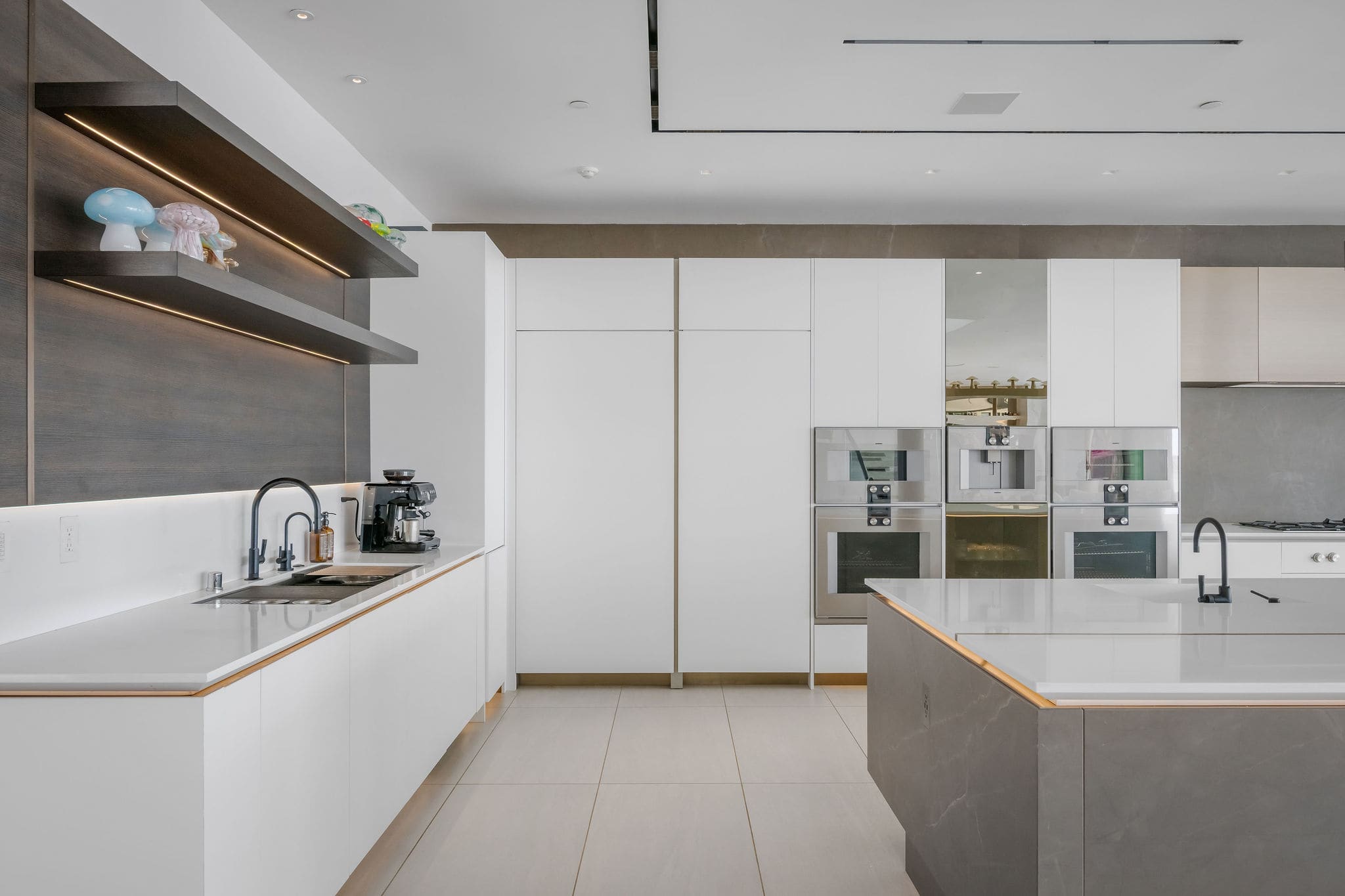 Custom kitchen with clean-lined cabinetry and built-in Gaggenau appliances.