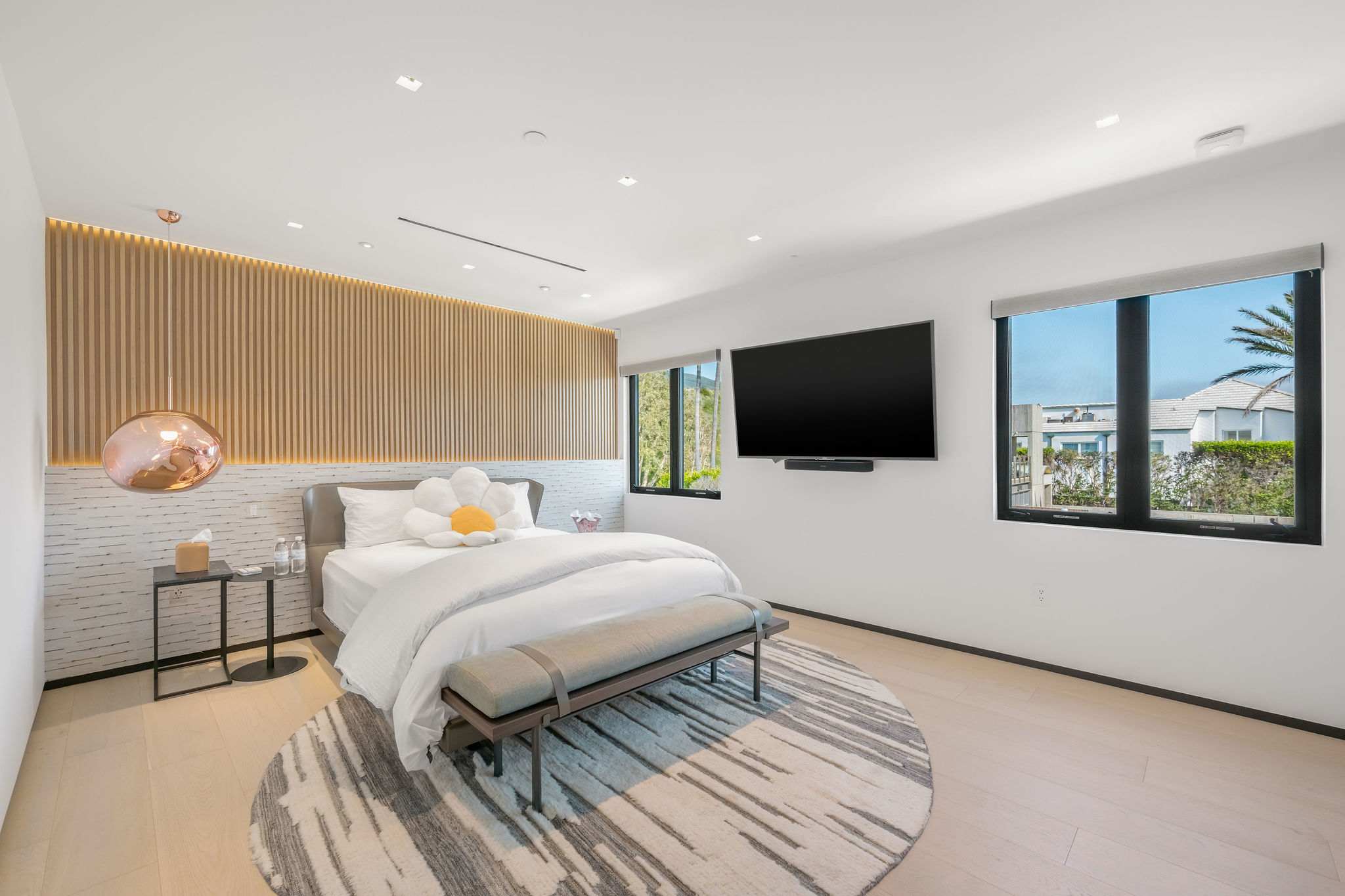 Wood-paneled feature wall with built-in TV and a clean, modern layout.
