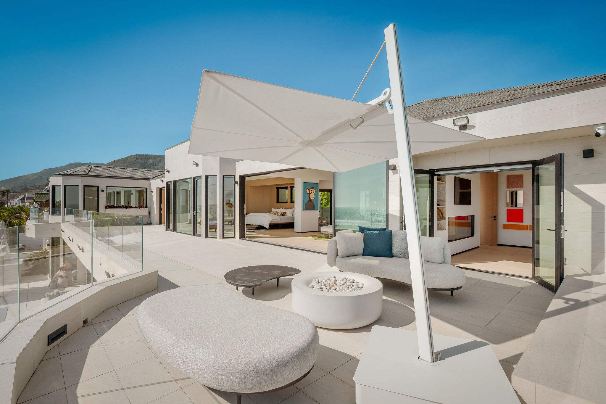 Settle into shaded outdoor seating, with the beachfront terrace wrapped around you.