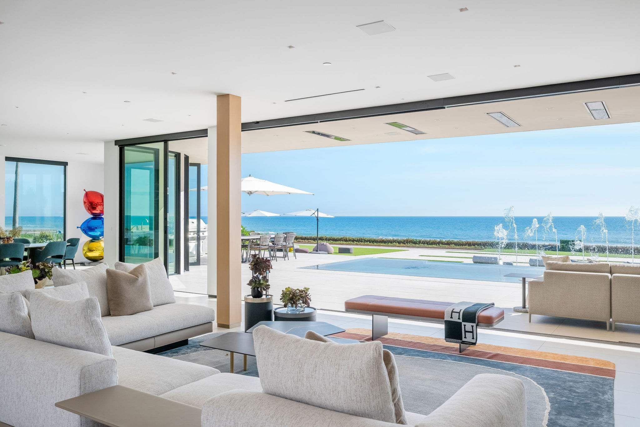 Slide the doors open and step from the living room onto your beachfront terrace.