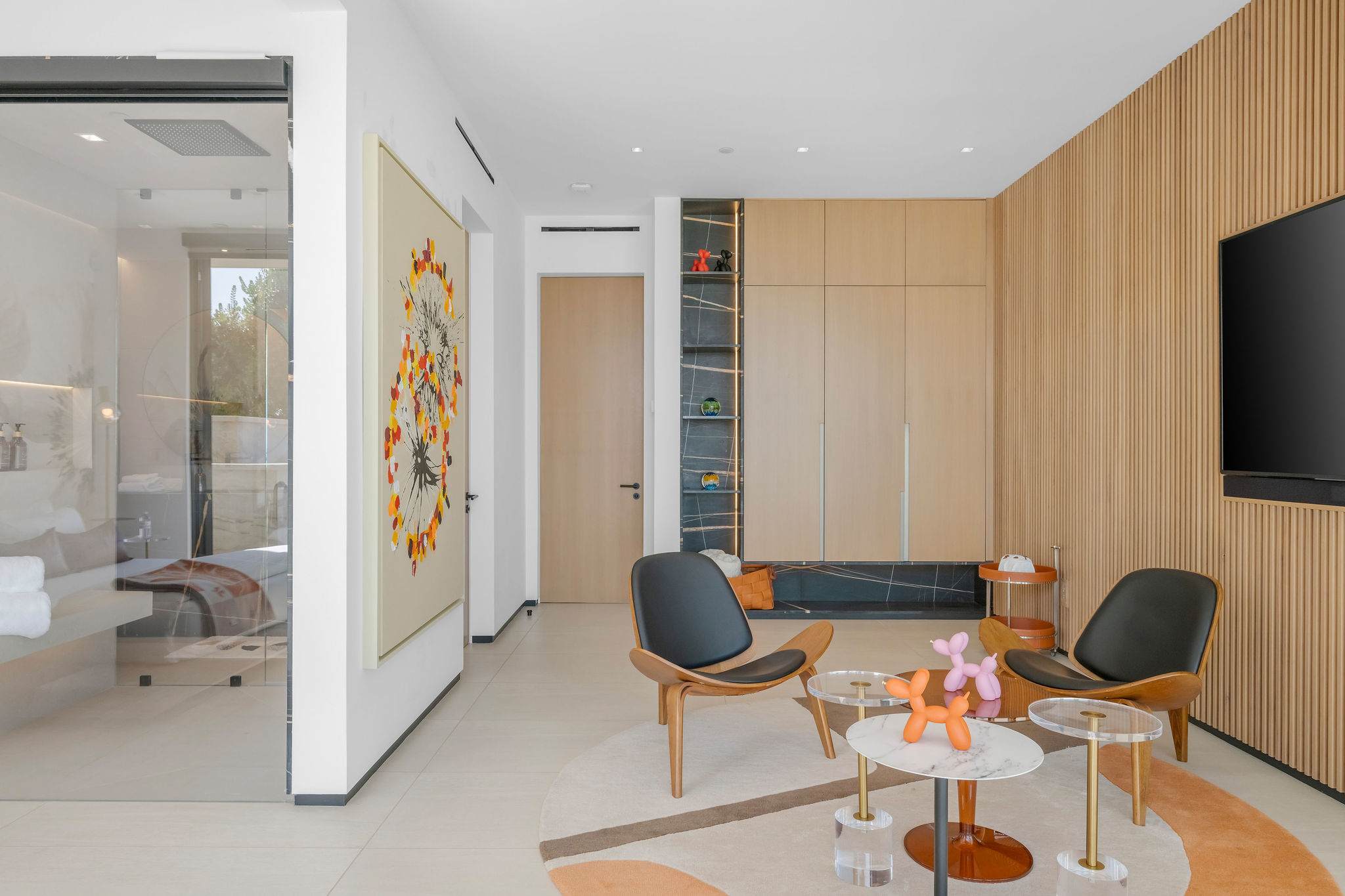 A bedroom with a built-in lounge area, extending the room’s footprint.