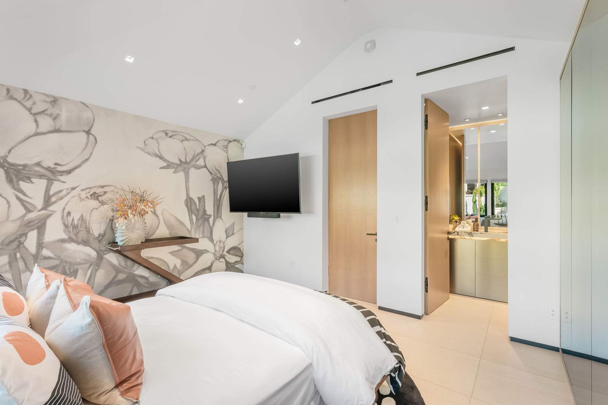 A bedroom suite where everything connects effortlessly, with direct access to a private bathroom.