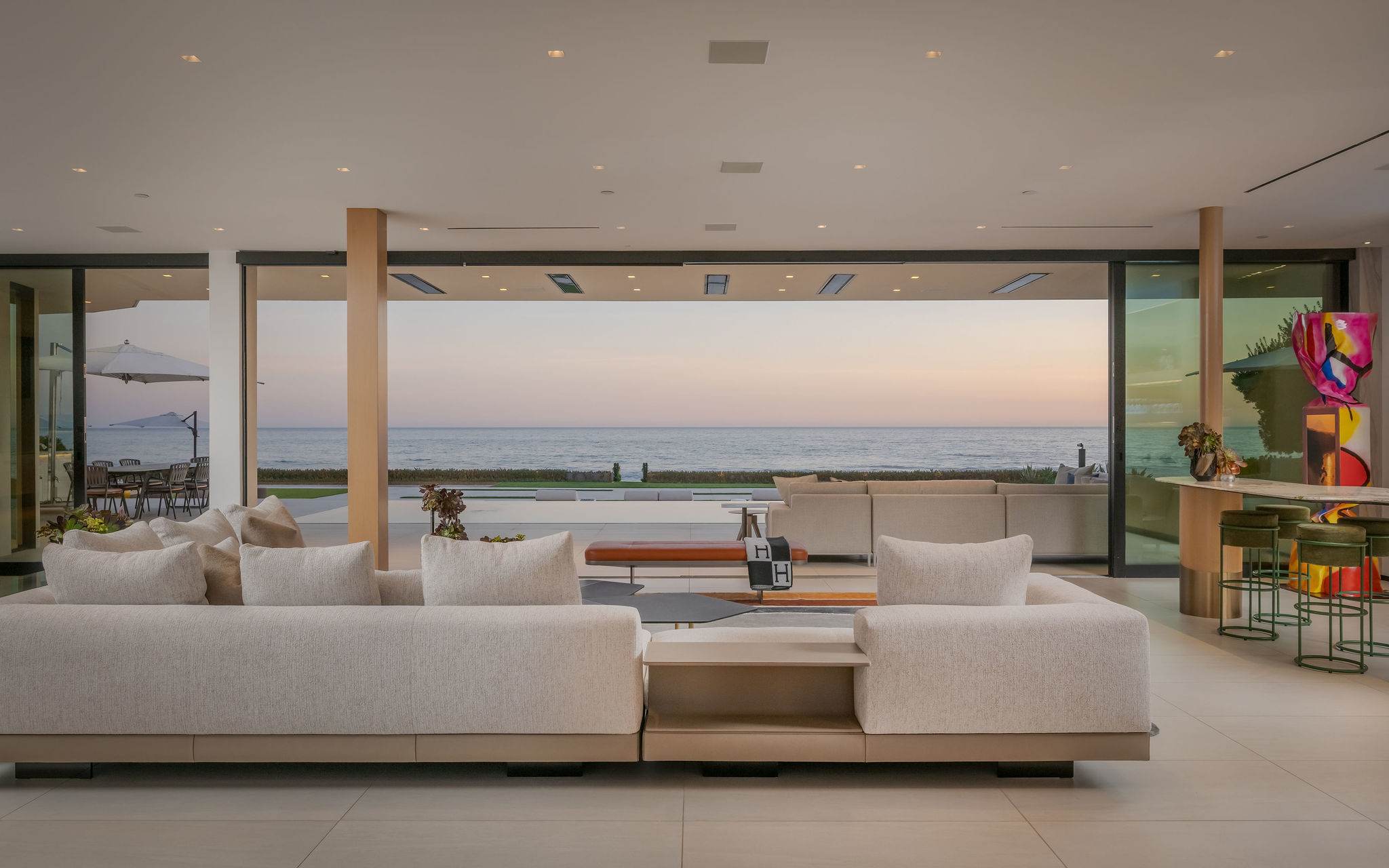 The entire space pulls your focus straight out to the Pacific-facing glass opening.