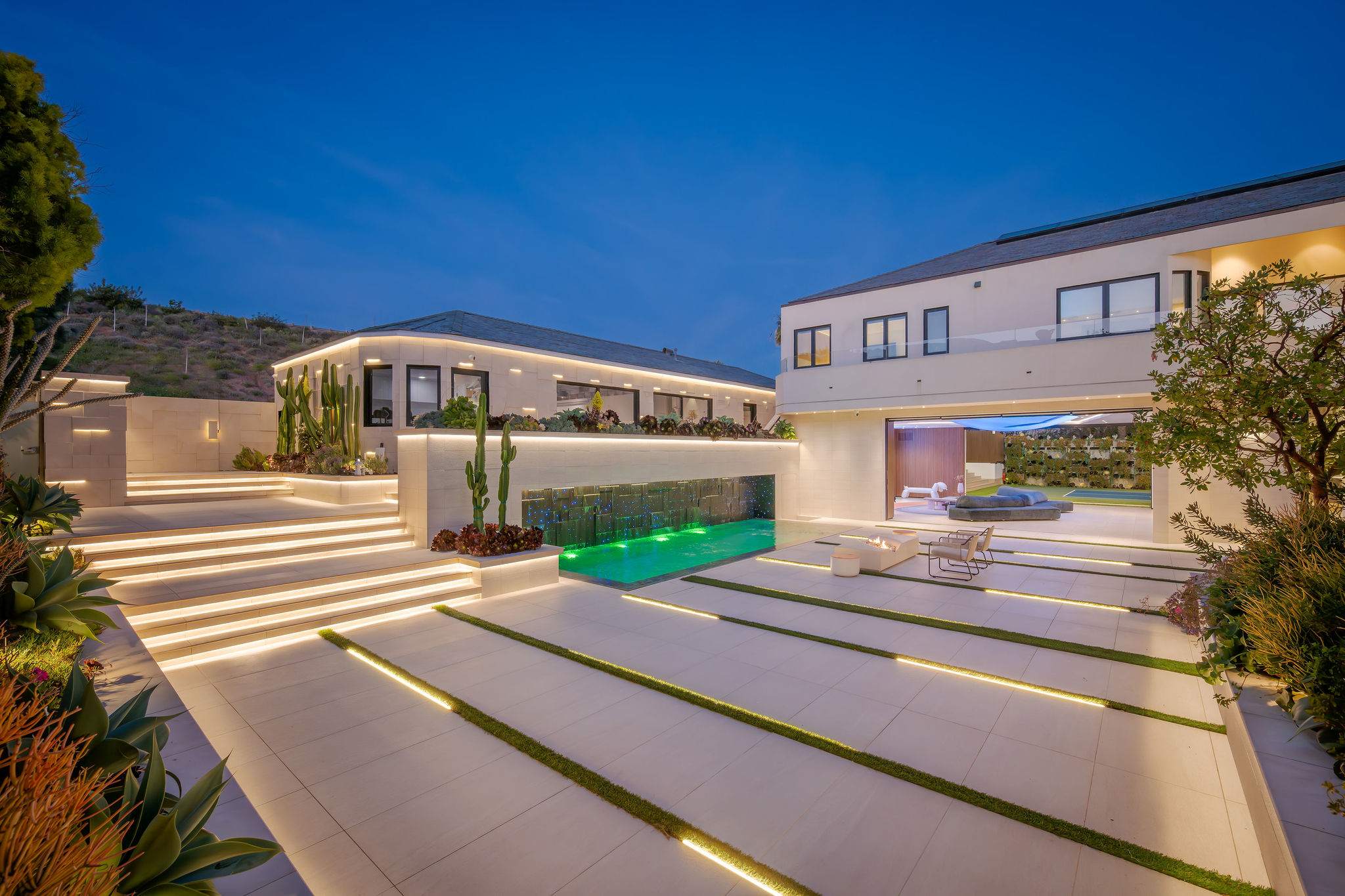 A lit arrival path draws you into the home from the moment you enter.