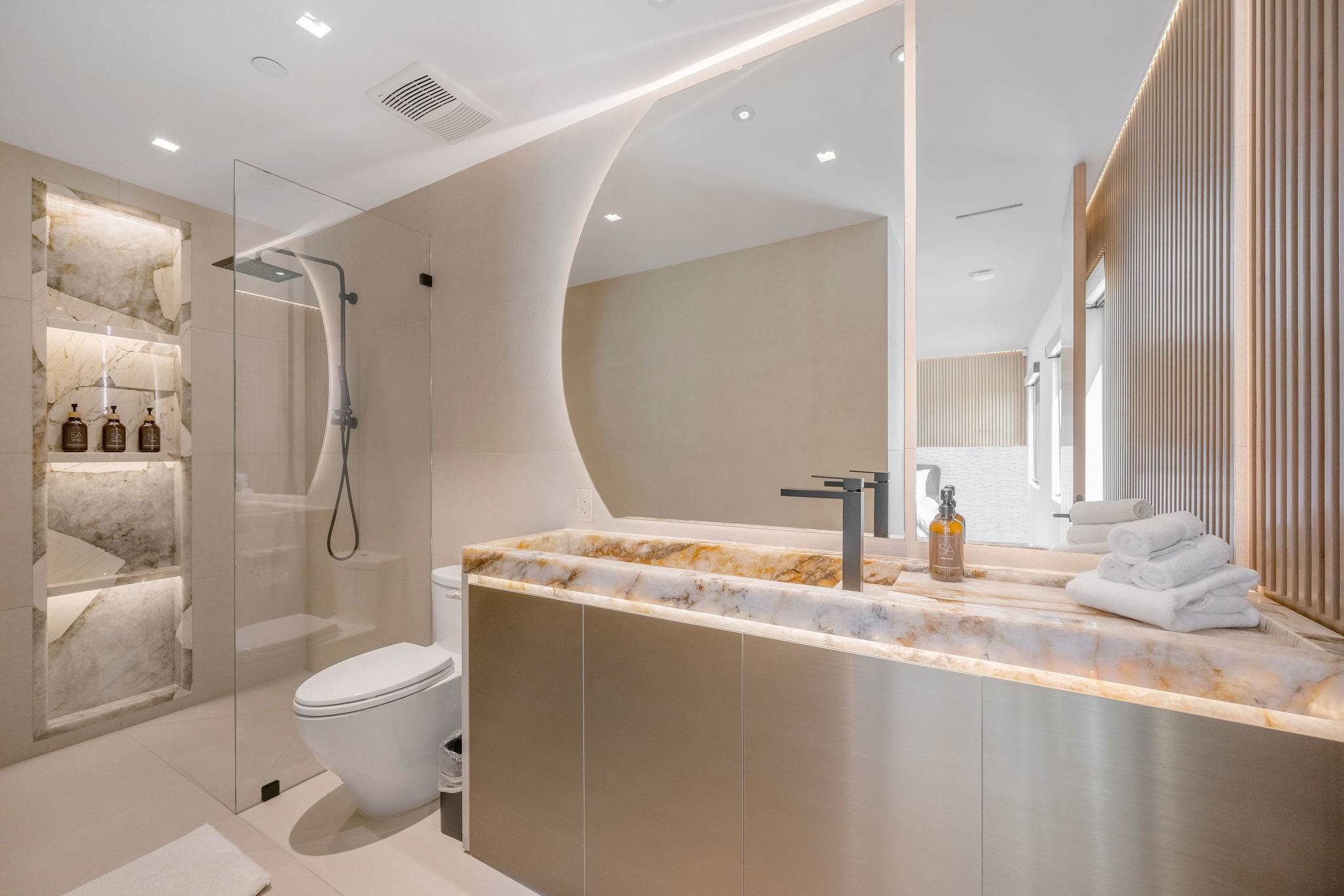 Reset in a spa-style bathroom, with soft lighting and a full walk-in shower.