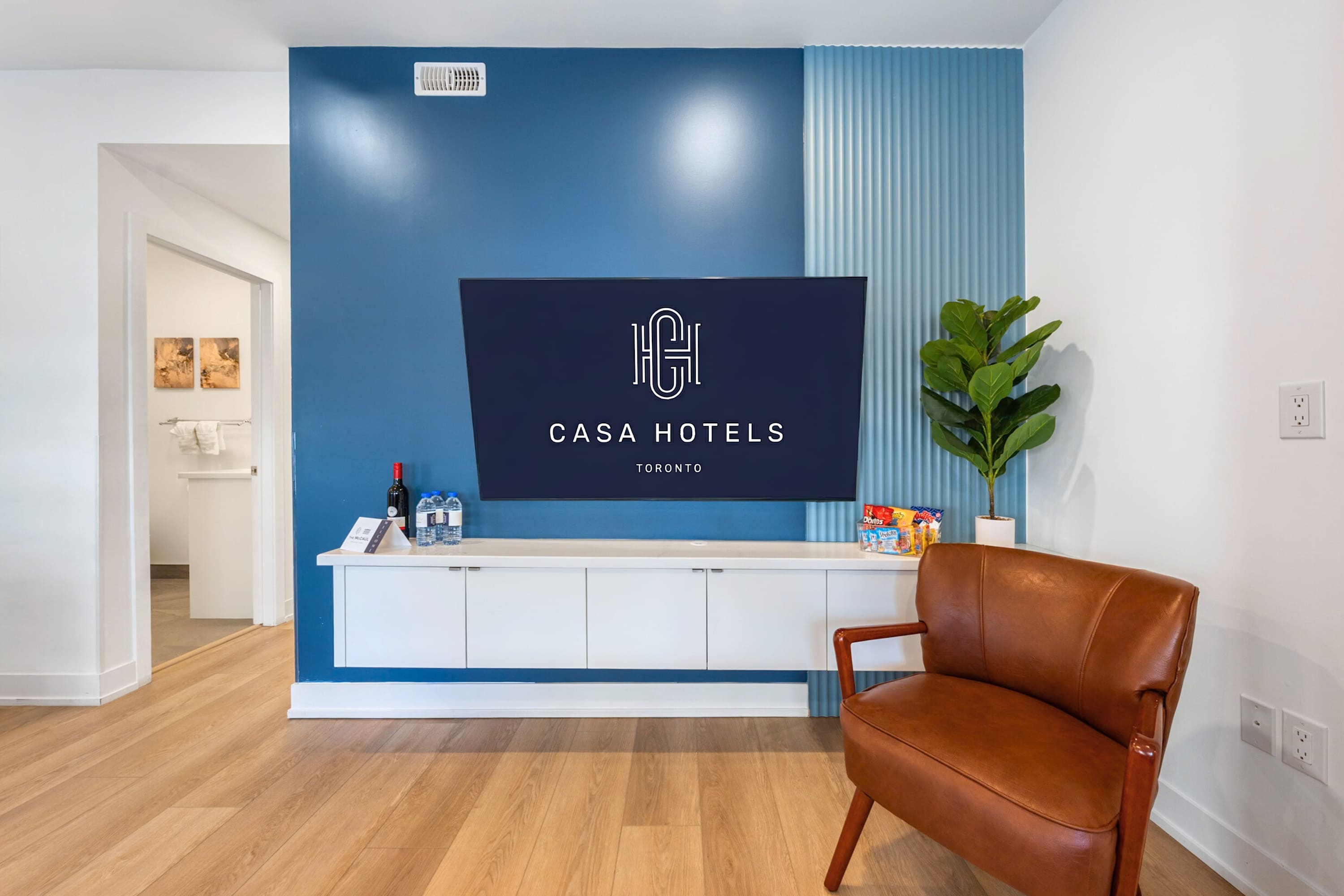 Inviting lounge space with large Smart TV and curated design details.