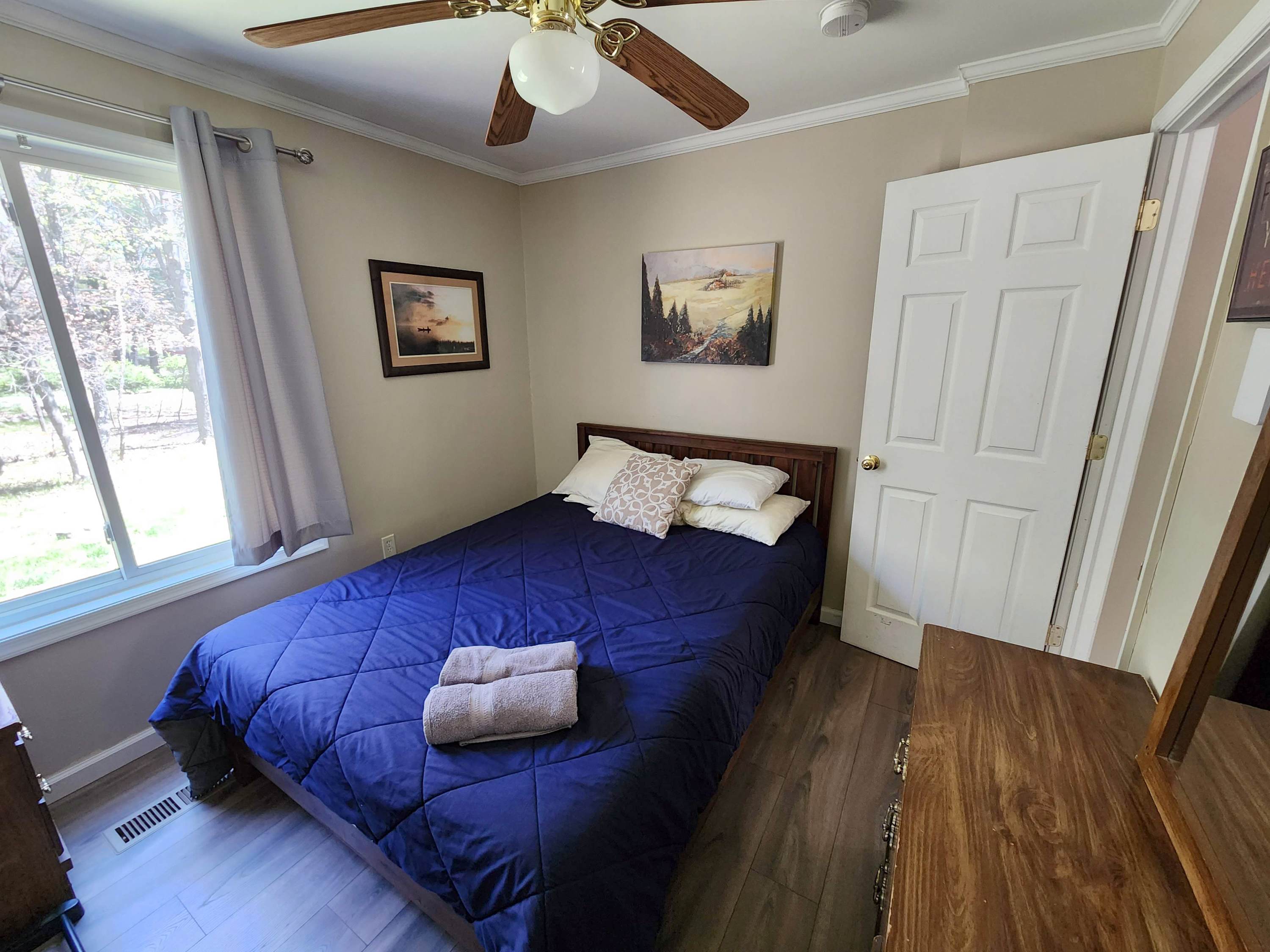 Drift off in a cozy bedroom with soft bedding and a calming blue palette