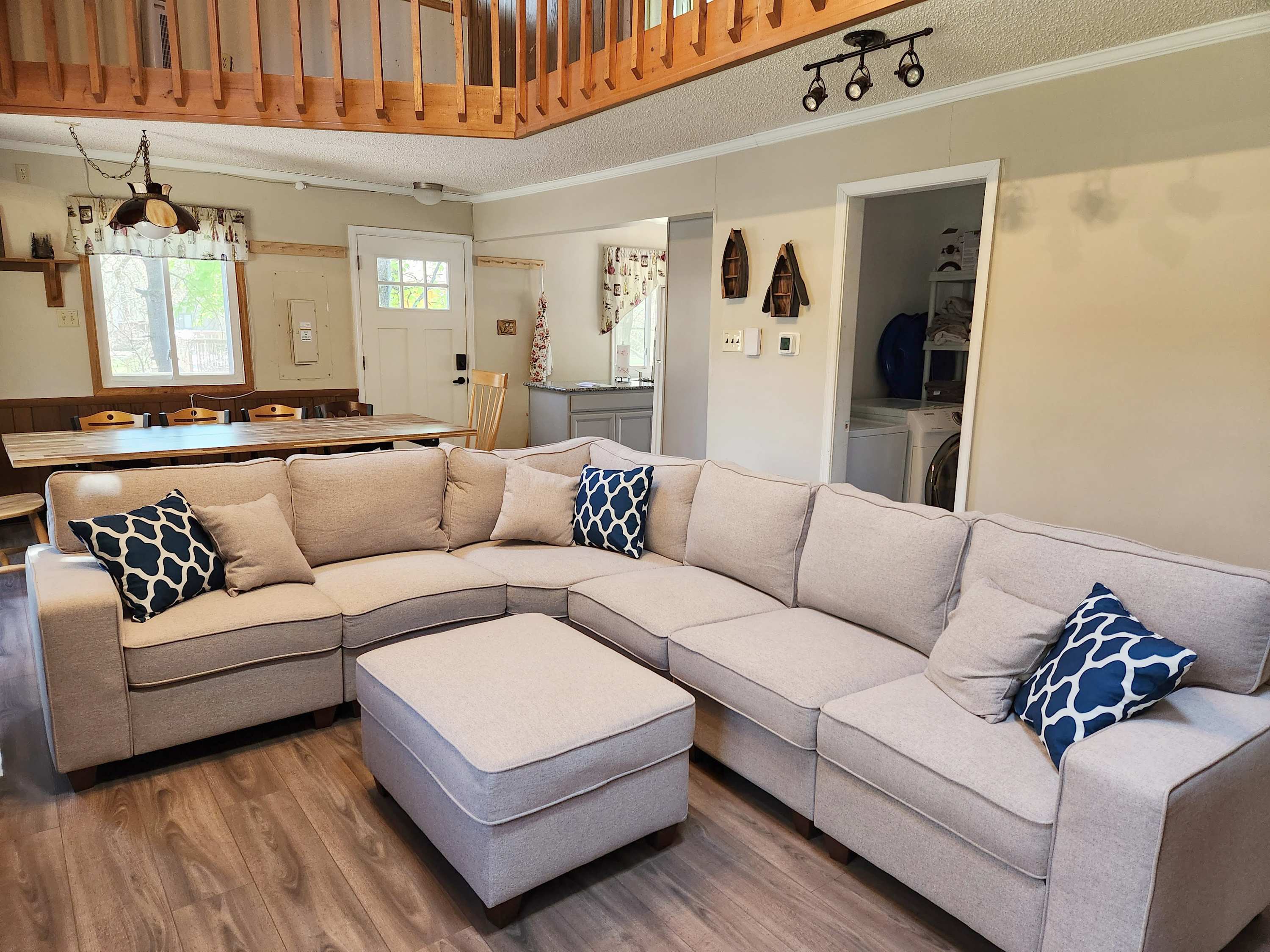 Sink into the sectional by the stone fireplace after a day of adventure